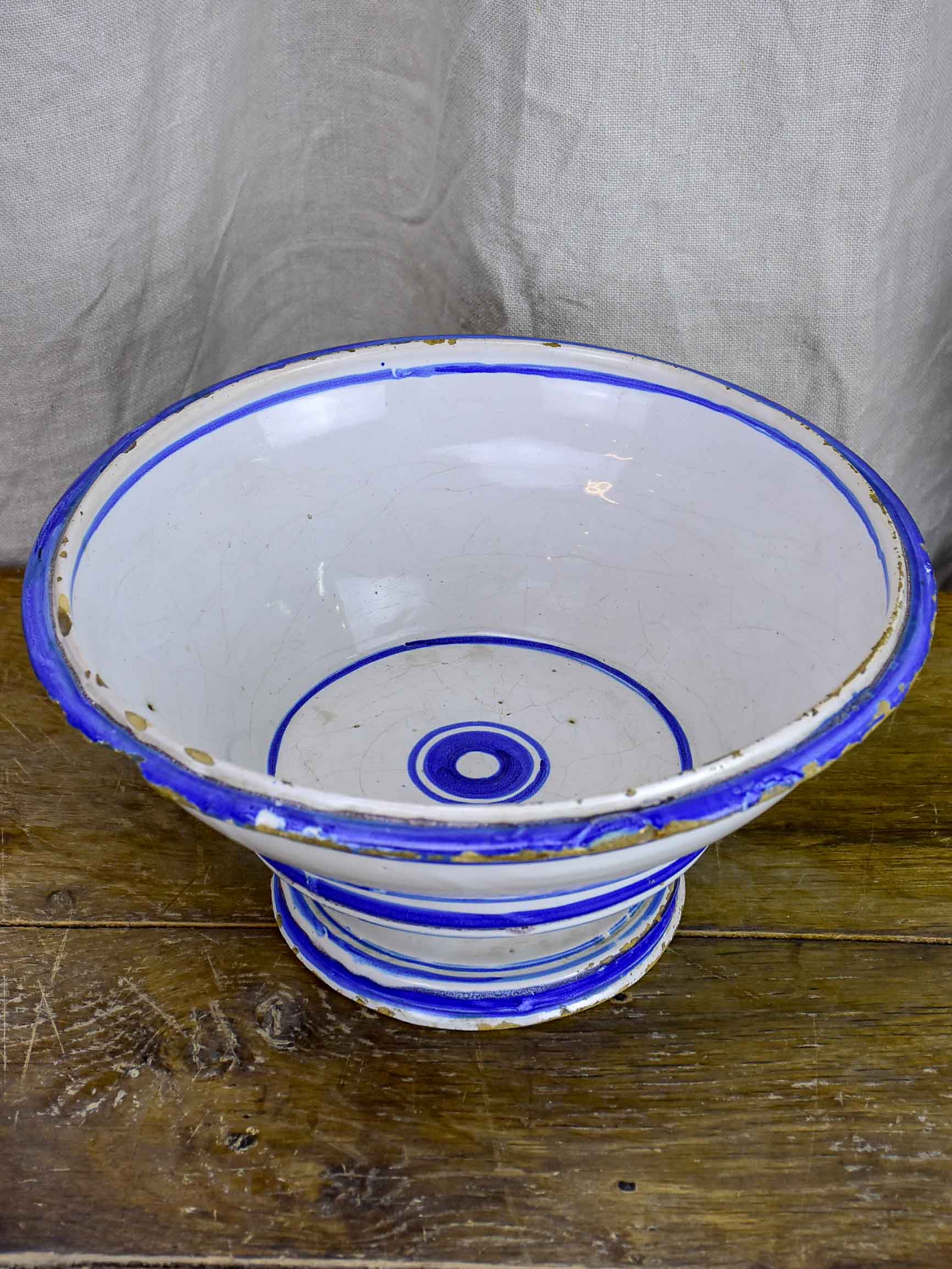 Antique fruit bowl with blue and white glaze