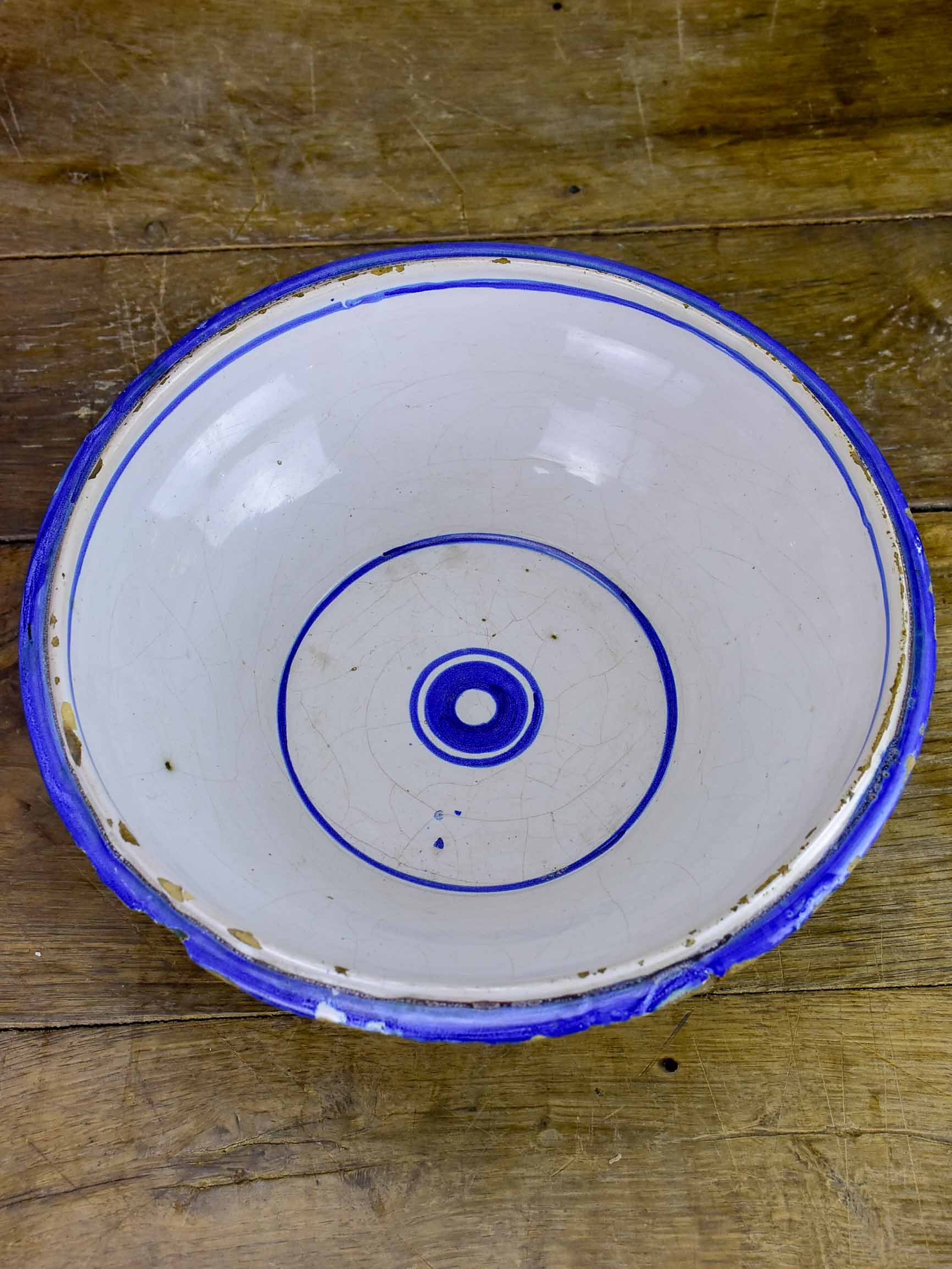 Antique fruit bowl with blue and white glaze