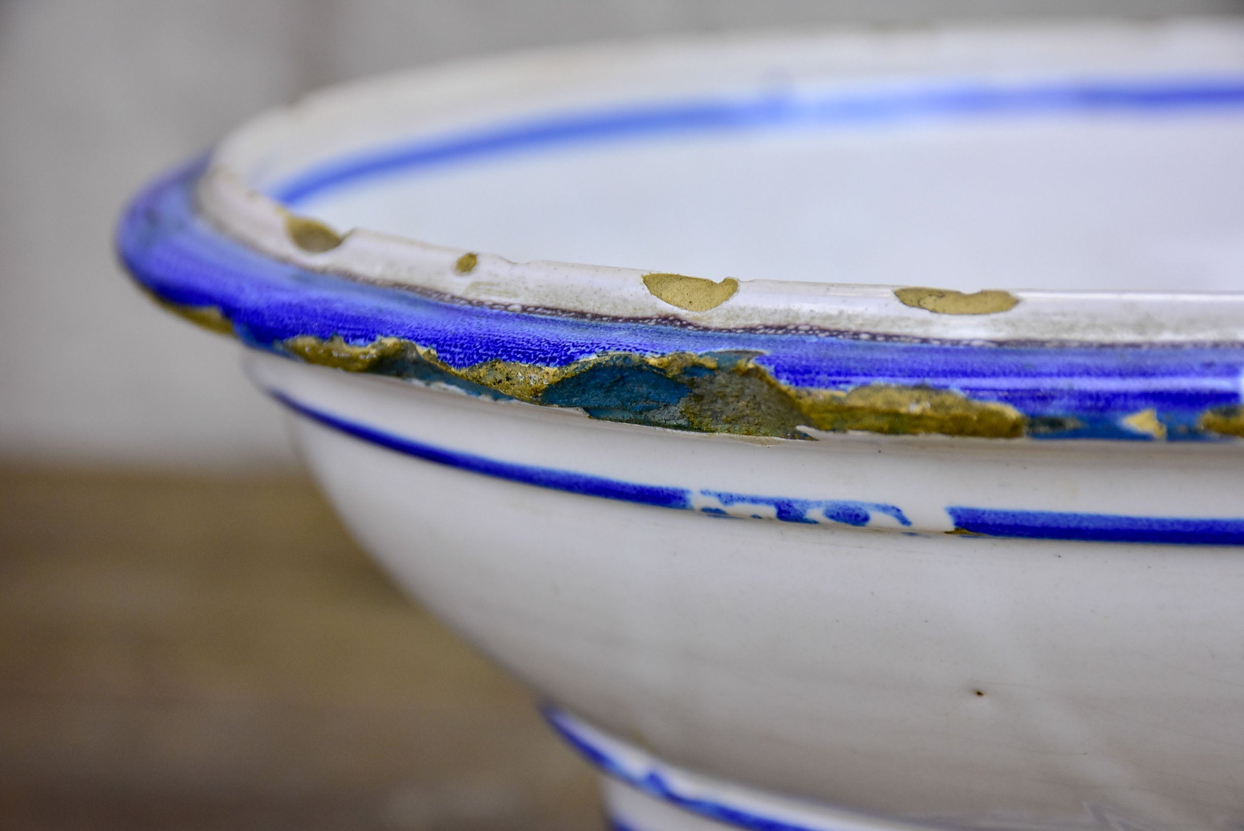 Antique fruit bowl with blue and white glaze