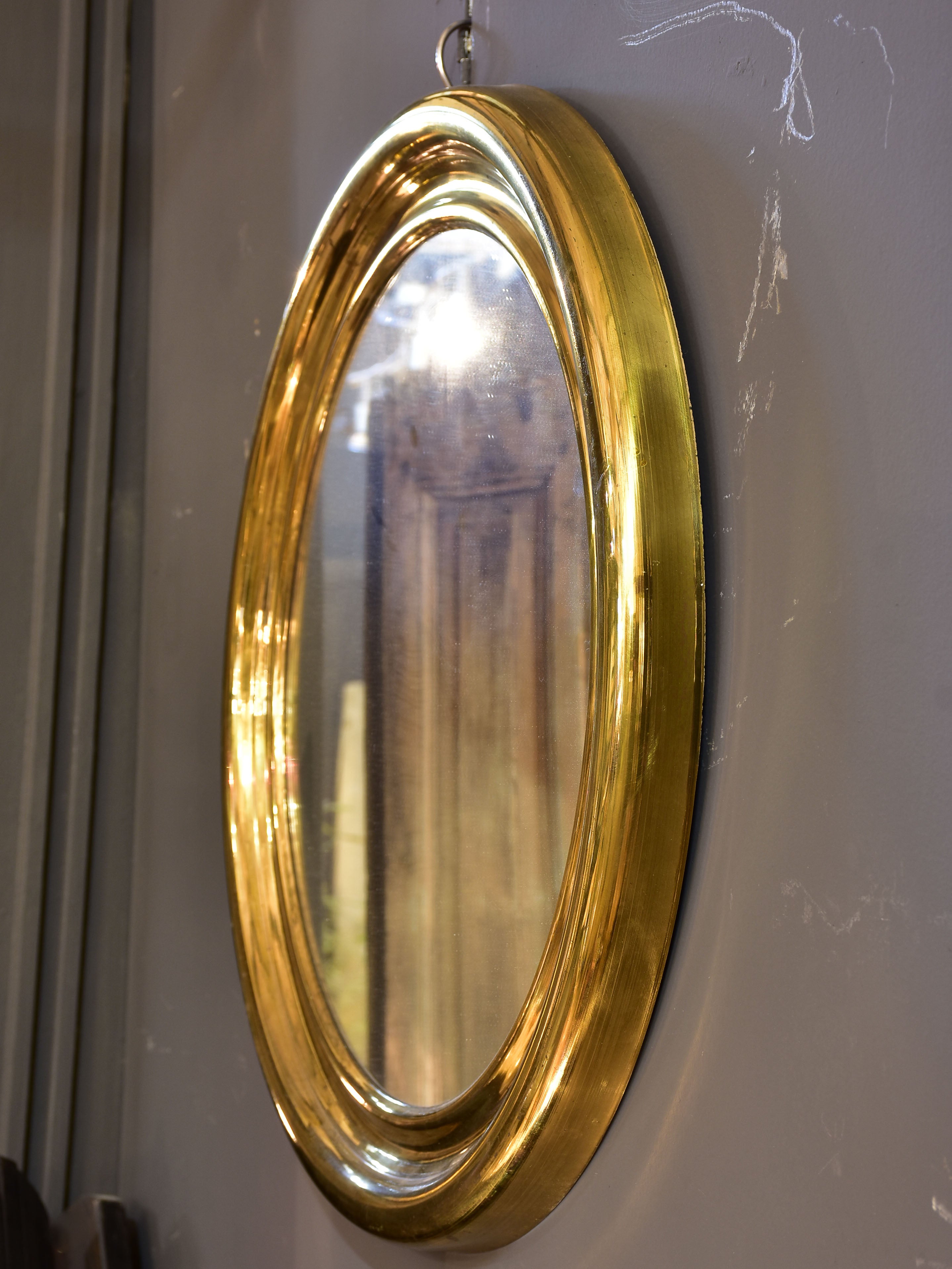 Round vintage French mirror with gold brass frame