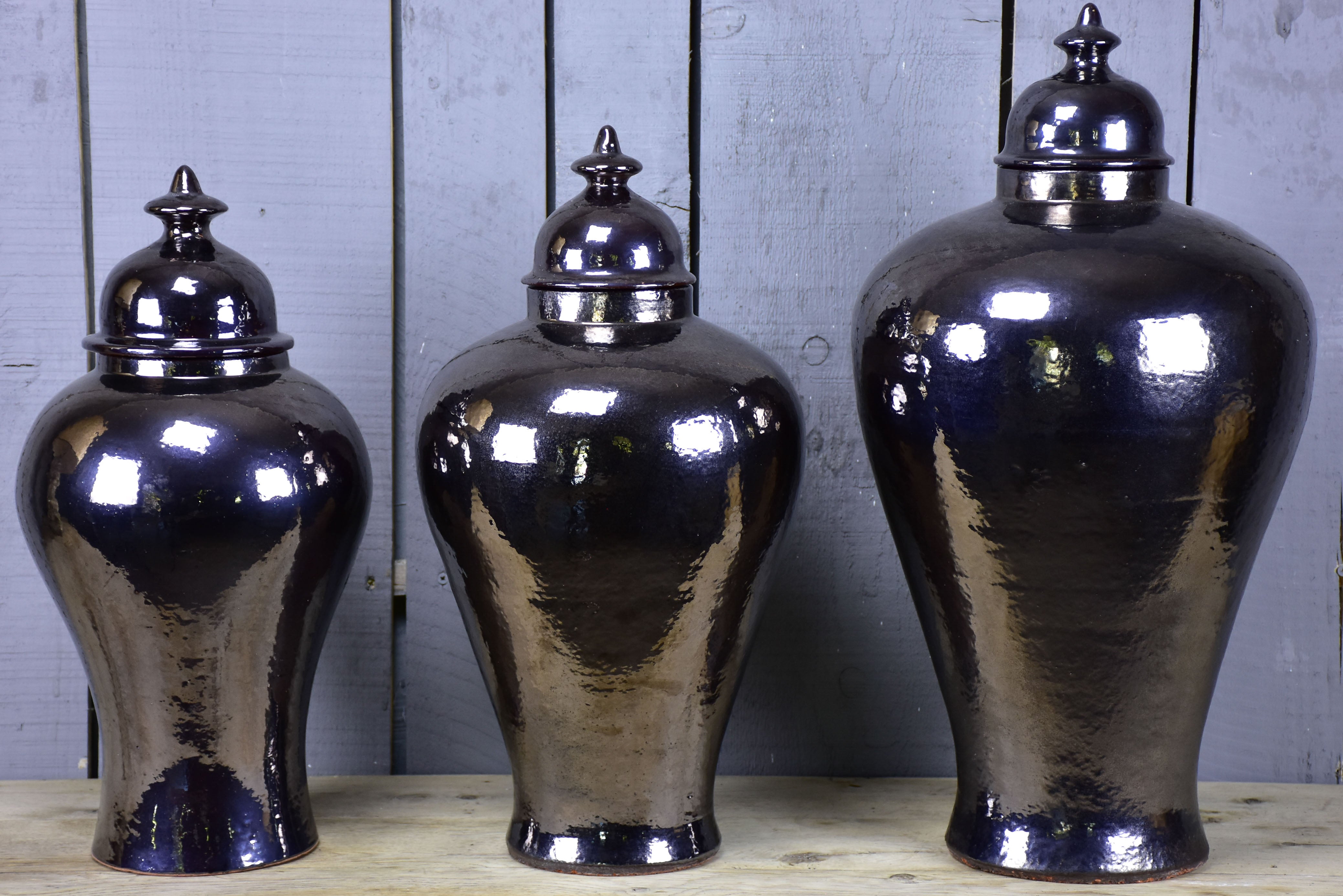 Three very large urns with enamel varnish