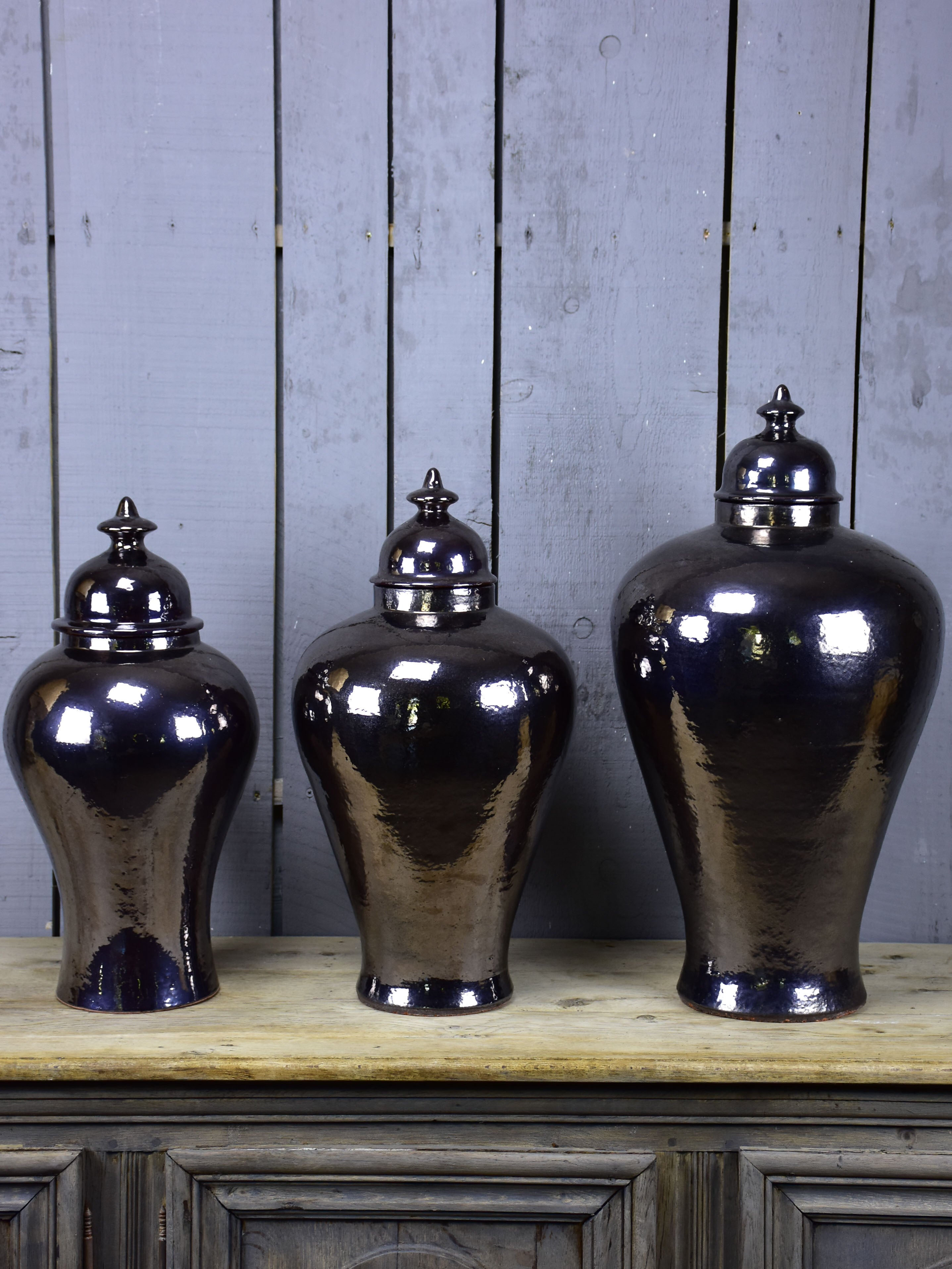 Three very large urns with enamel varnish