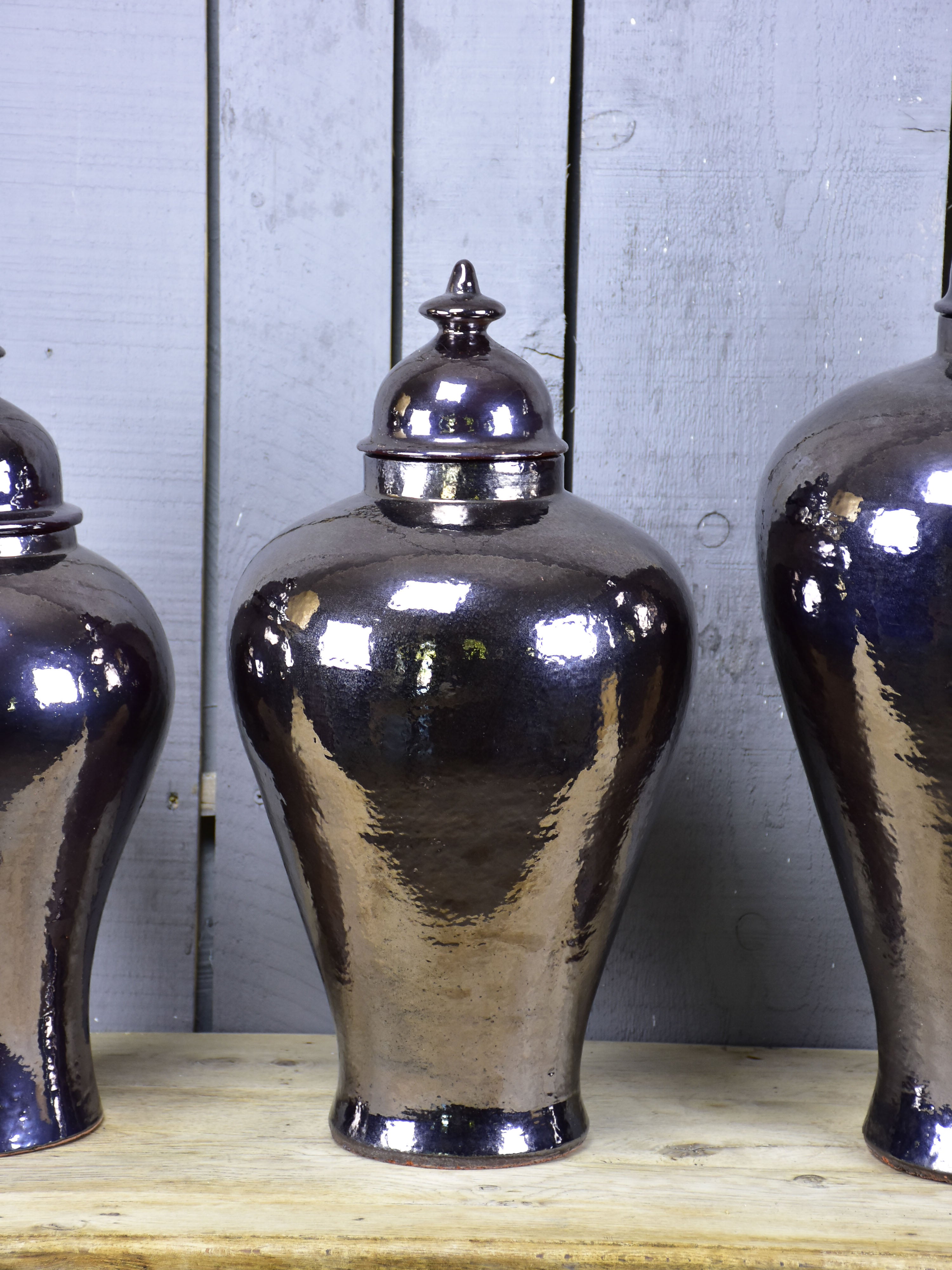 Three very large urns with enamel varnish