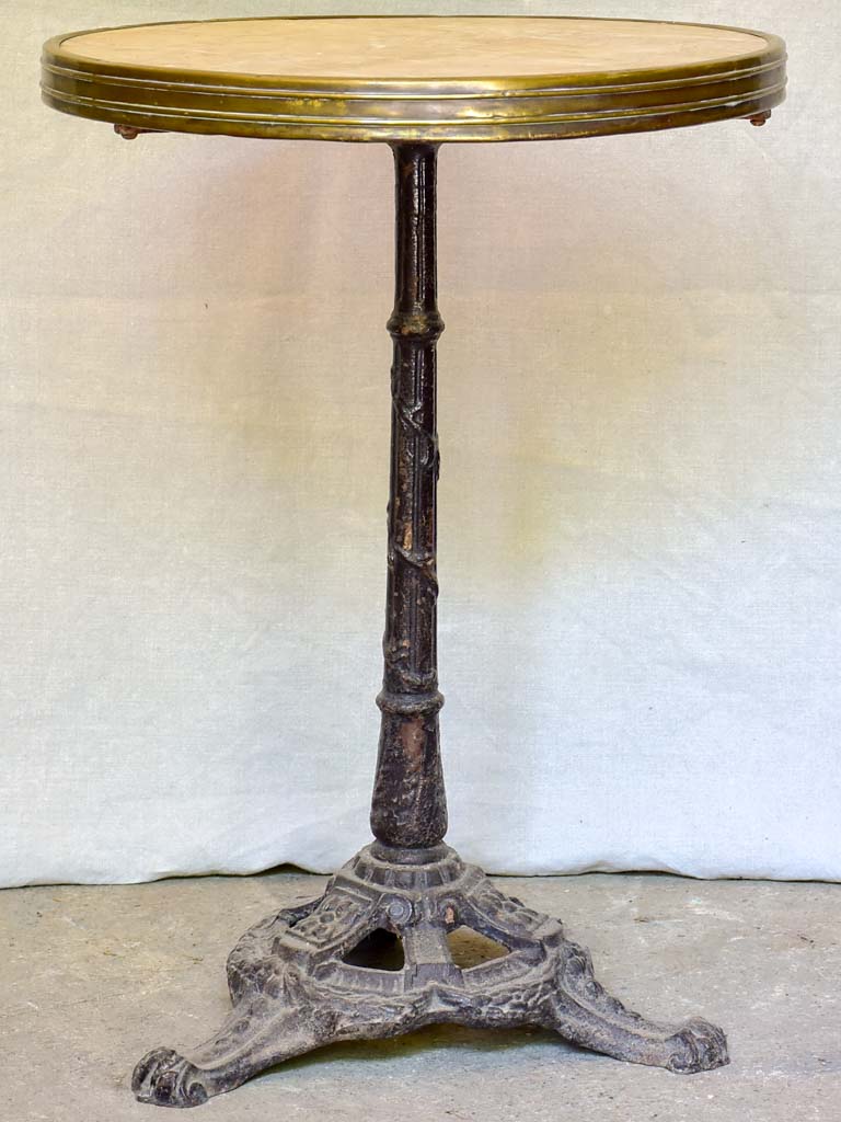 Early 20th-century bistro table with marble top and cast iron base