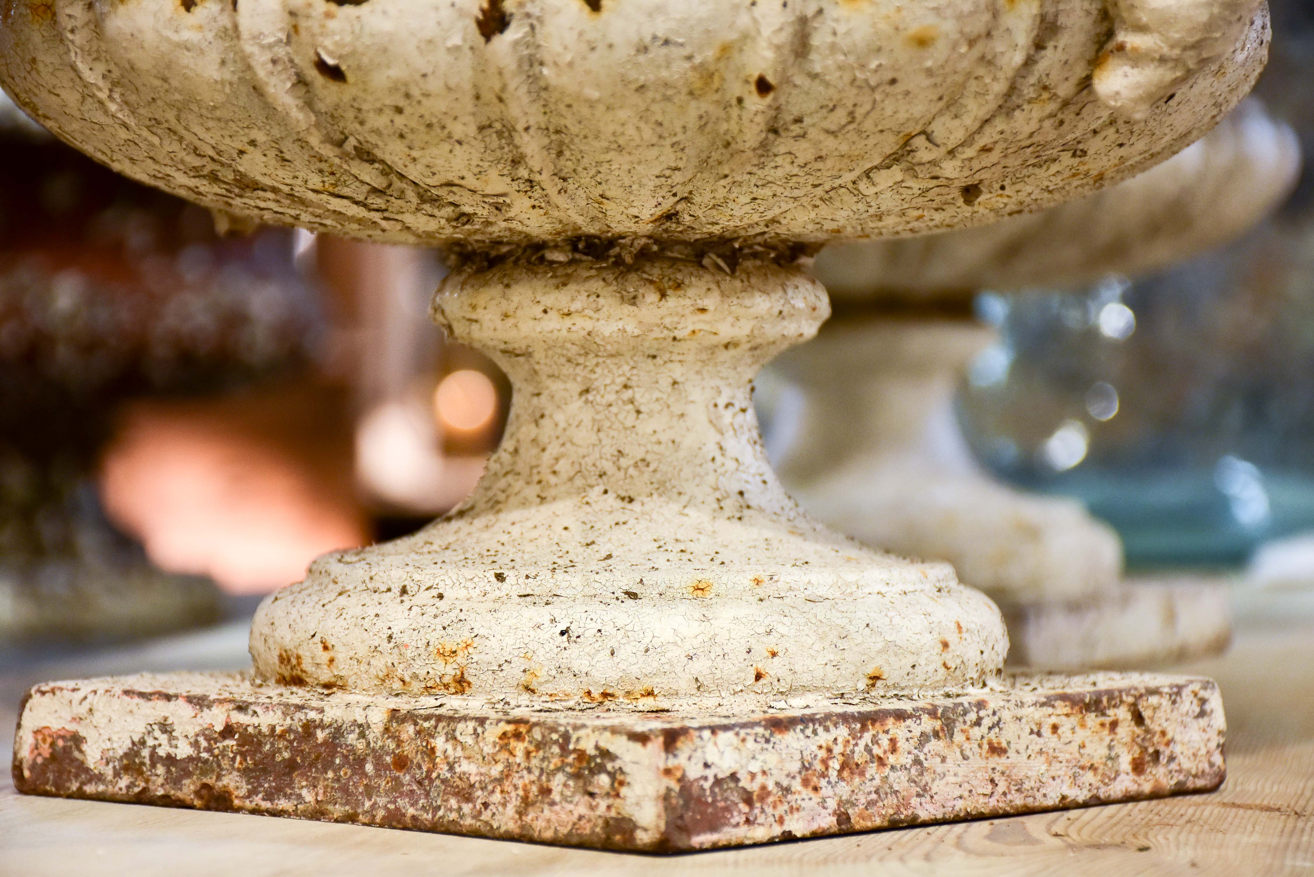 Pair of antique French cast iron garden urns with white patina