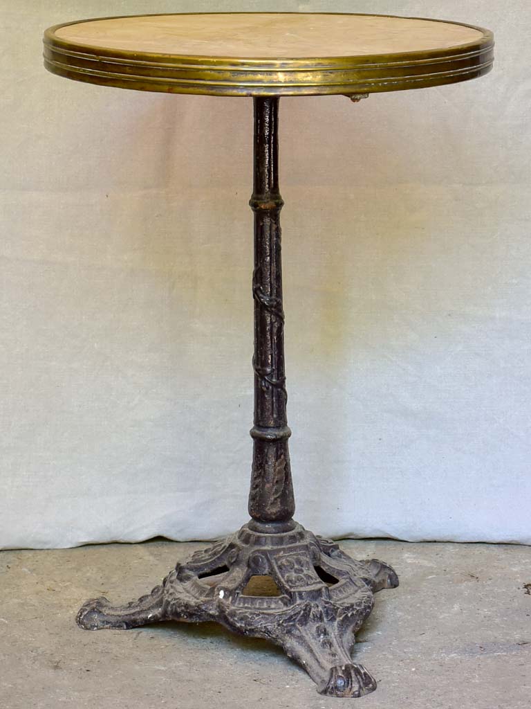 Early 20th-century bistro table with marble top and cast iron base