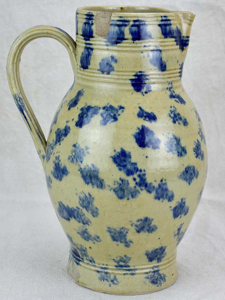 Rustic French pitcher with blue spots