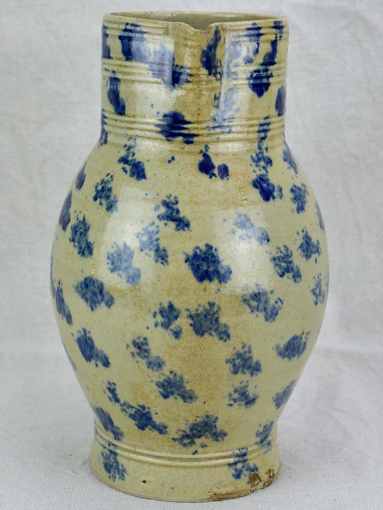 Rustic French pitcher with blue spots