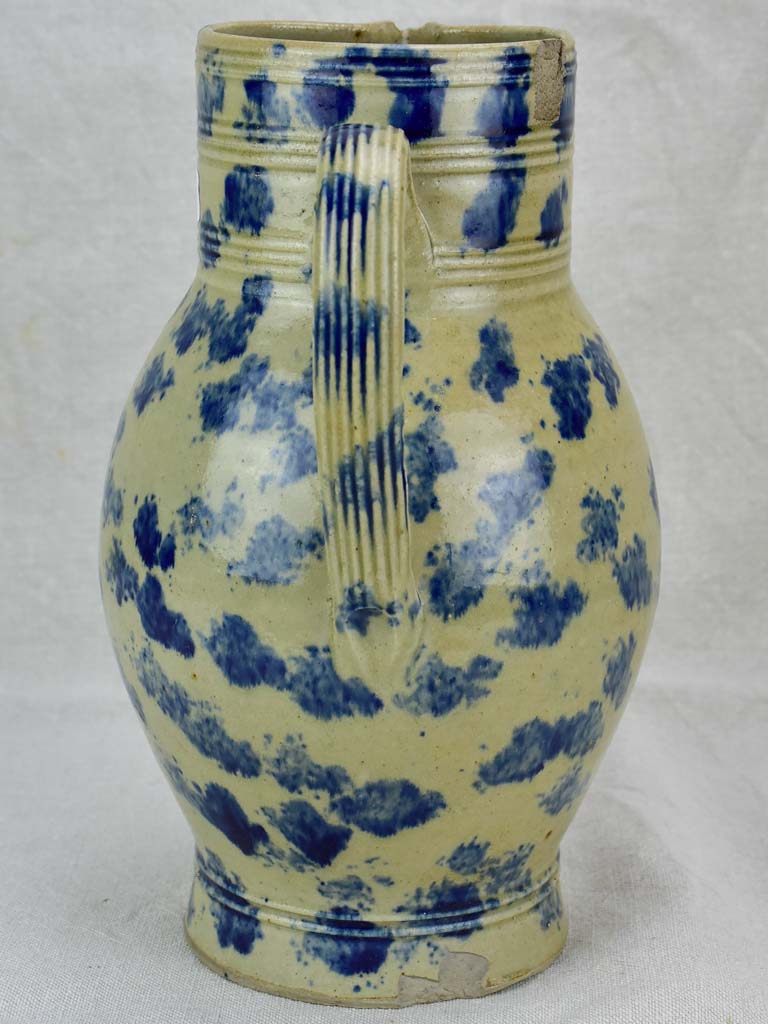 Rustic French pitcher with blue spots