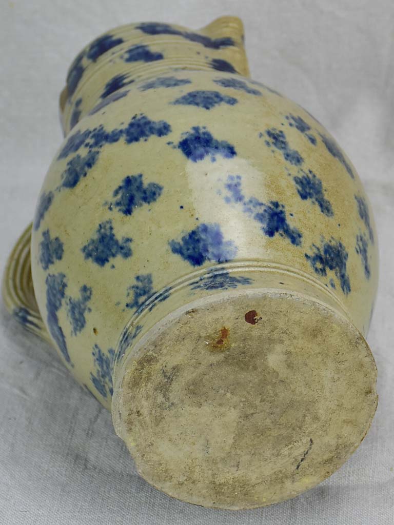 Rustic French pitcher with blue spots