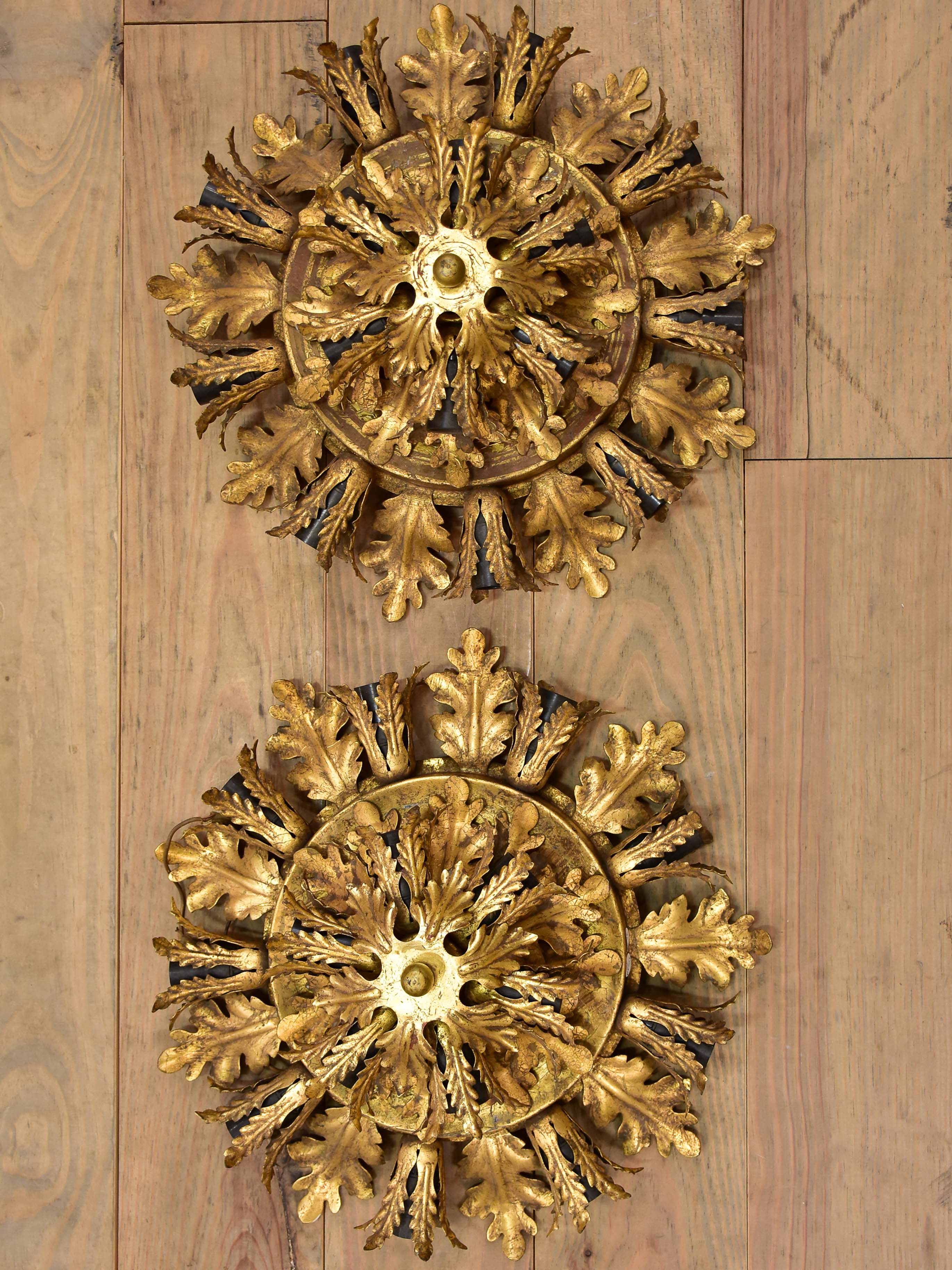 Pair of Maison Charles wall sconces / ceiling lights with gold leaves