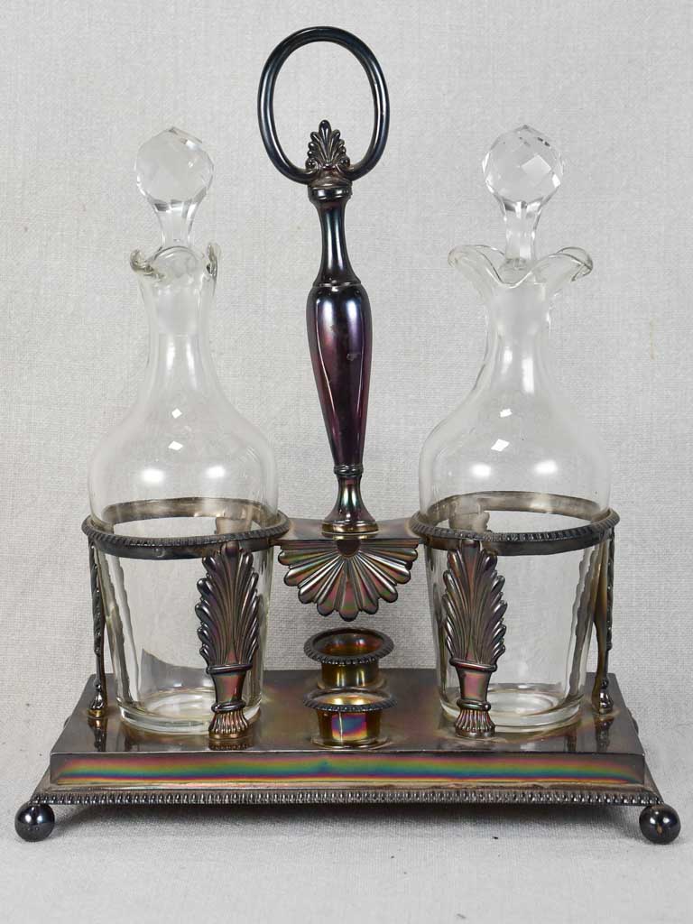 Two crystal carafes in a silver carrier