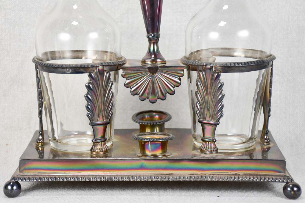 Two crystal carafes in a silver carrier