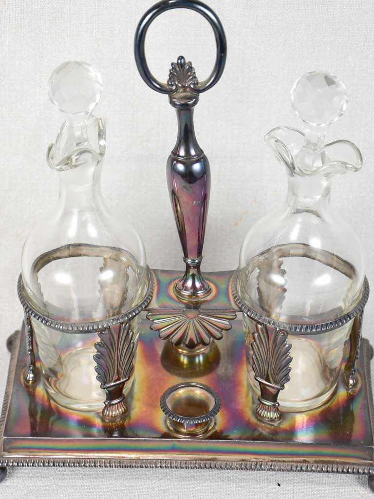 Two crystal carafes in a silver carrier