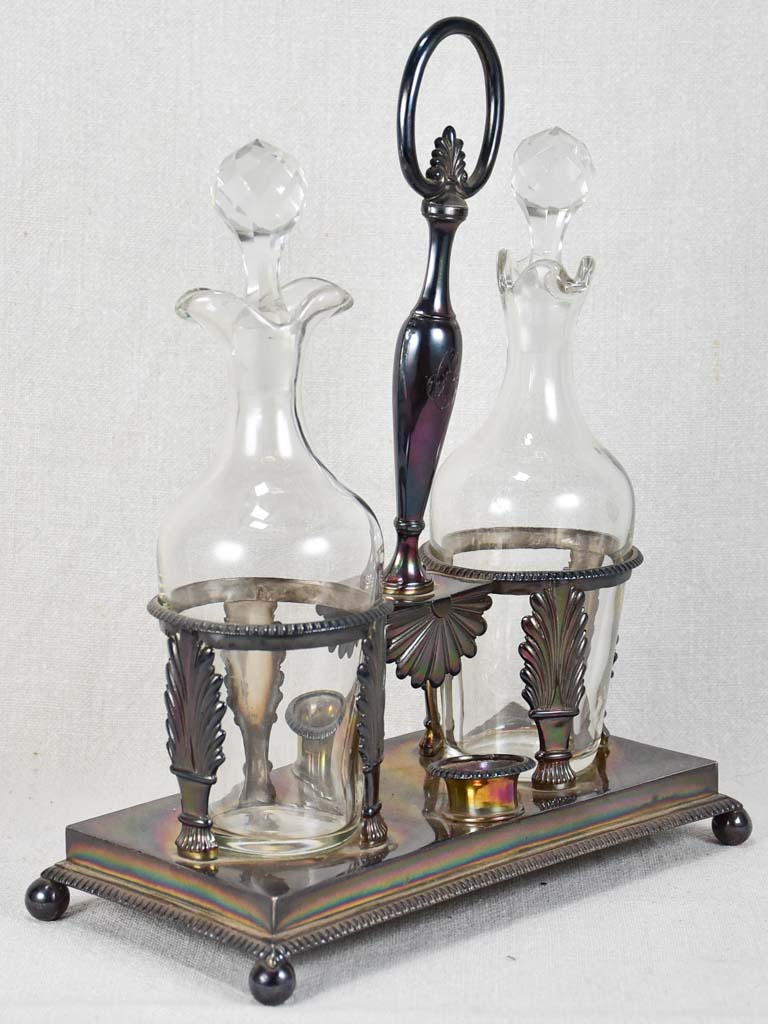 Two crystal carafes in a silver carrier