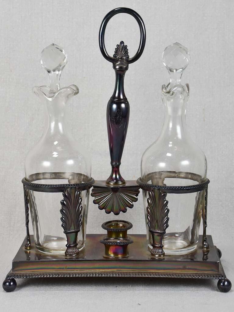 Two crystal carafes in a silver carrier