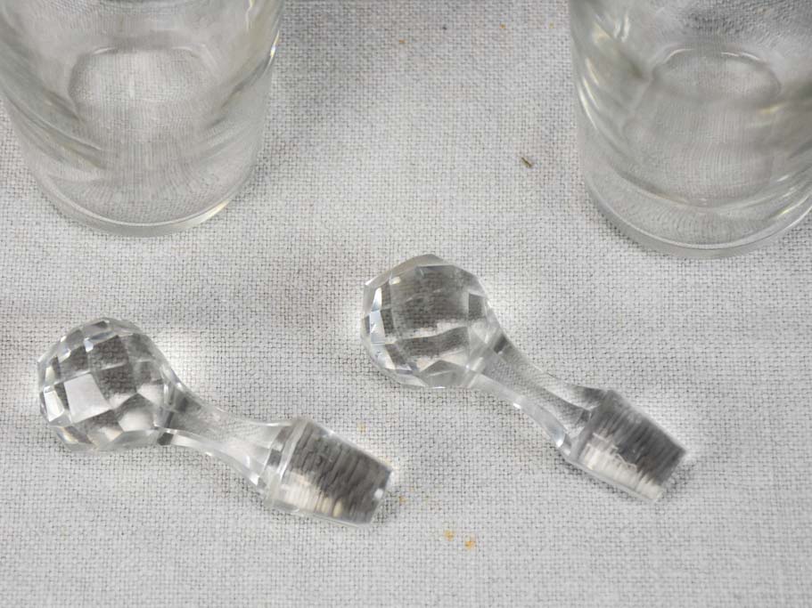 Two crystal carafes in a silver carrier