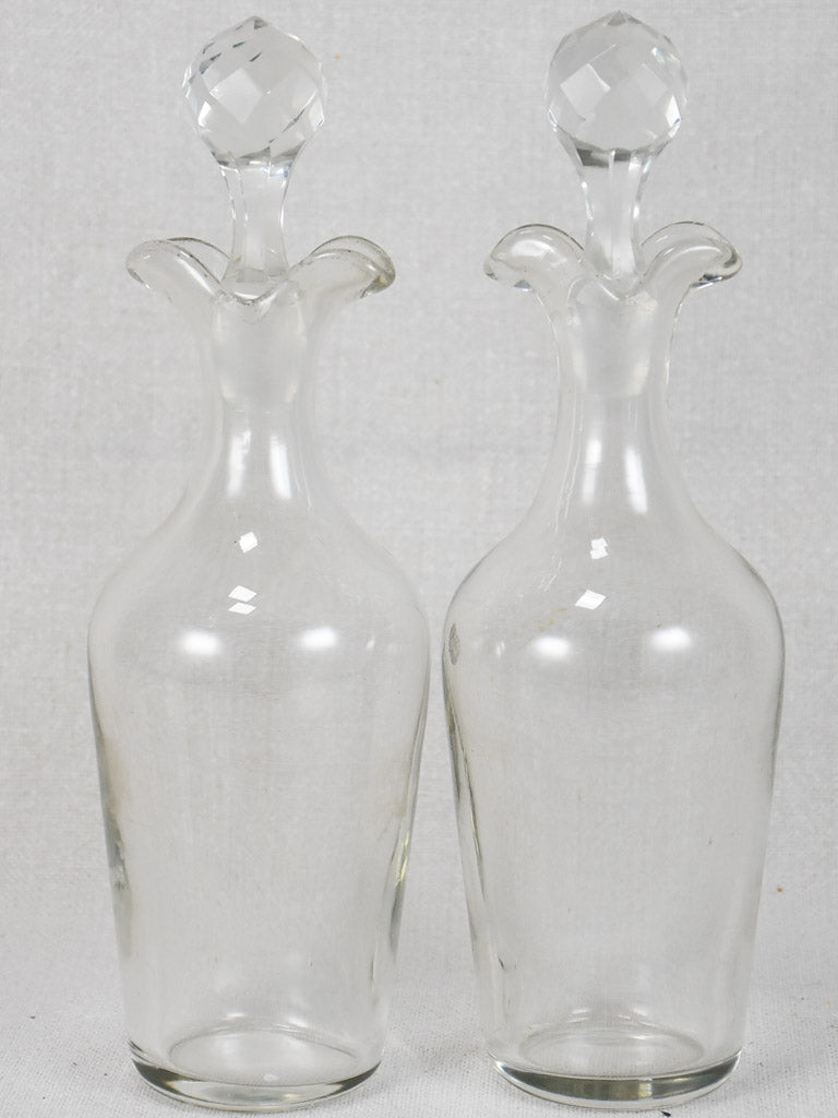 Two crystal carafes in a silver carrier