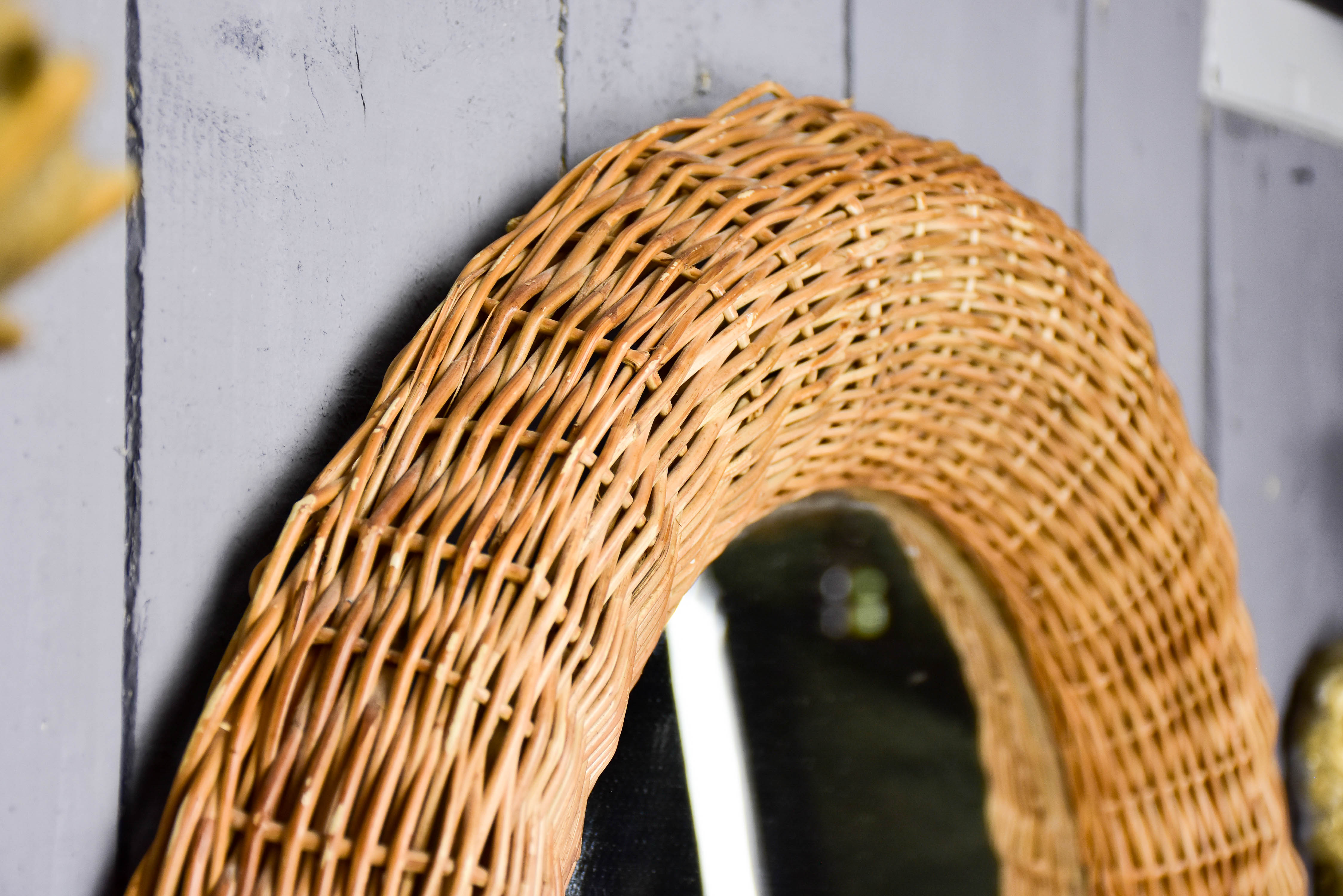 Vintage round mirror with cane frame