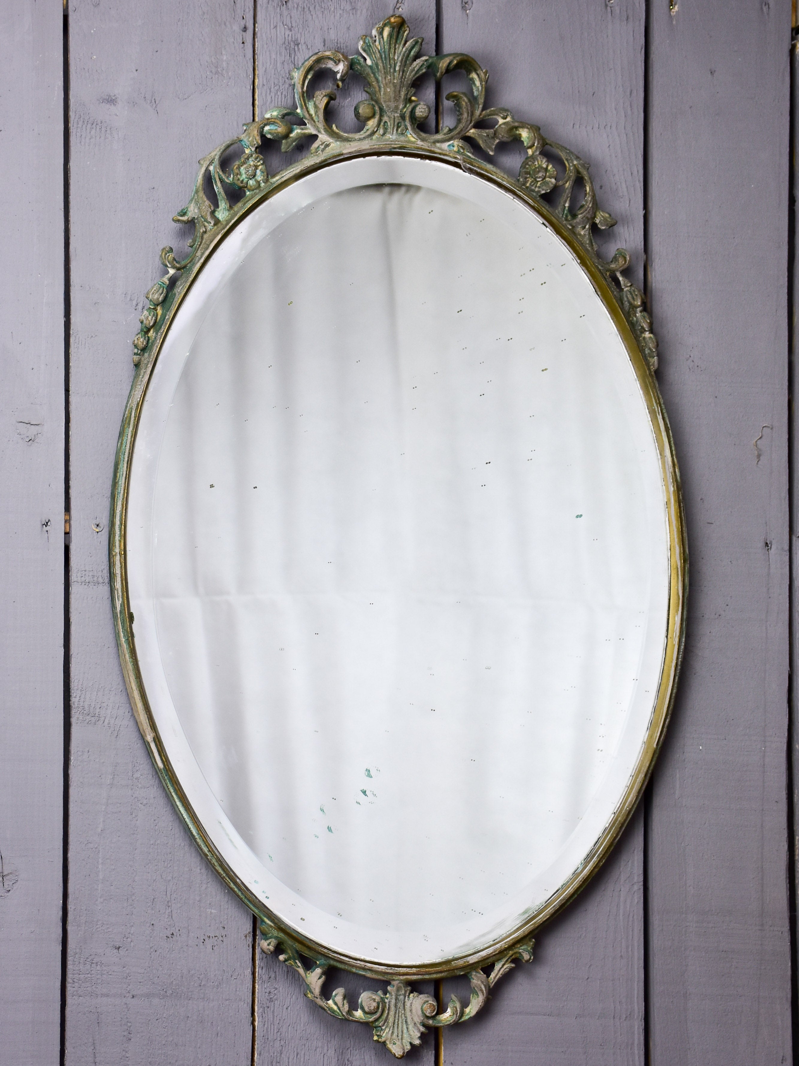 Vintage oval mirror with iron frame