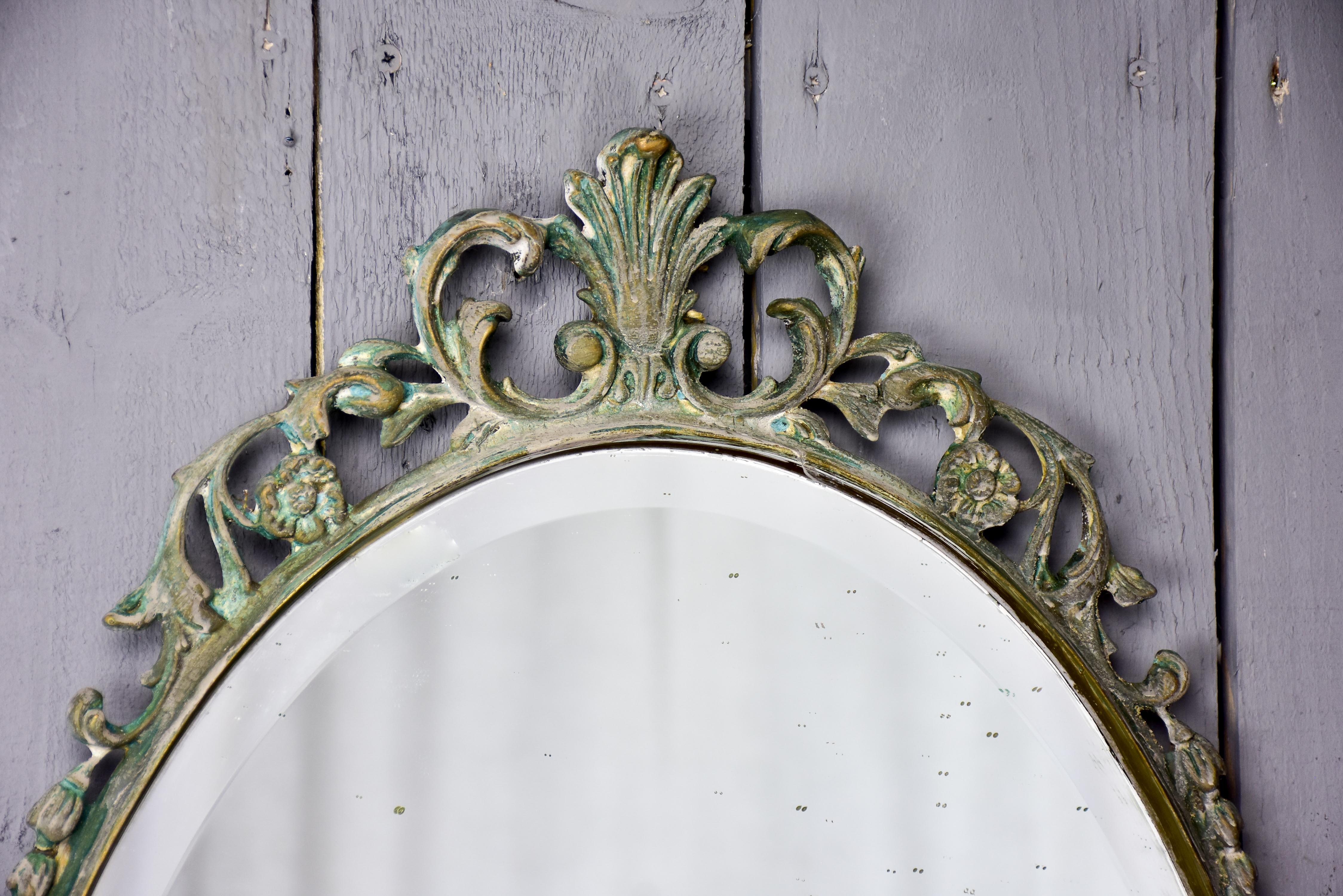 Vintage oval mirror with iron frame