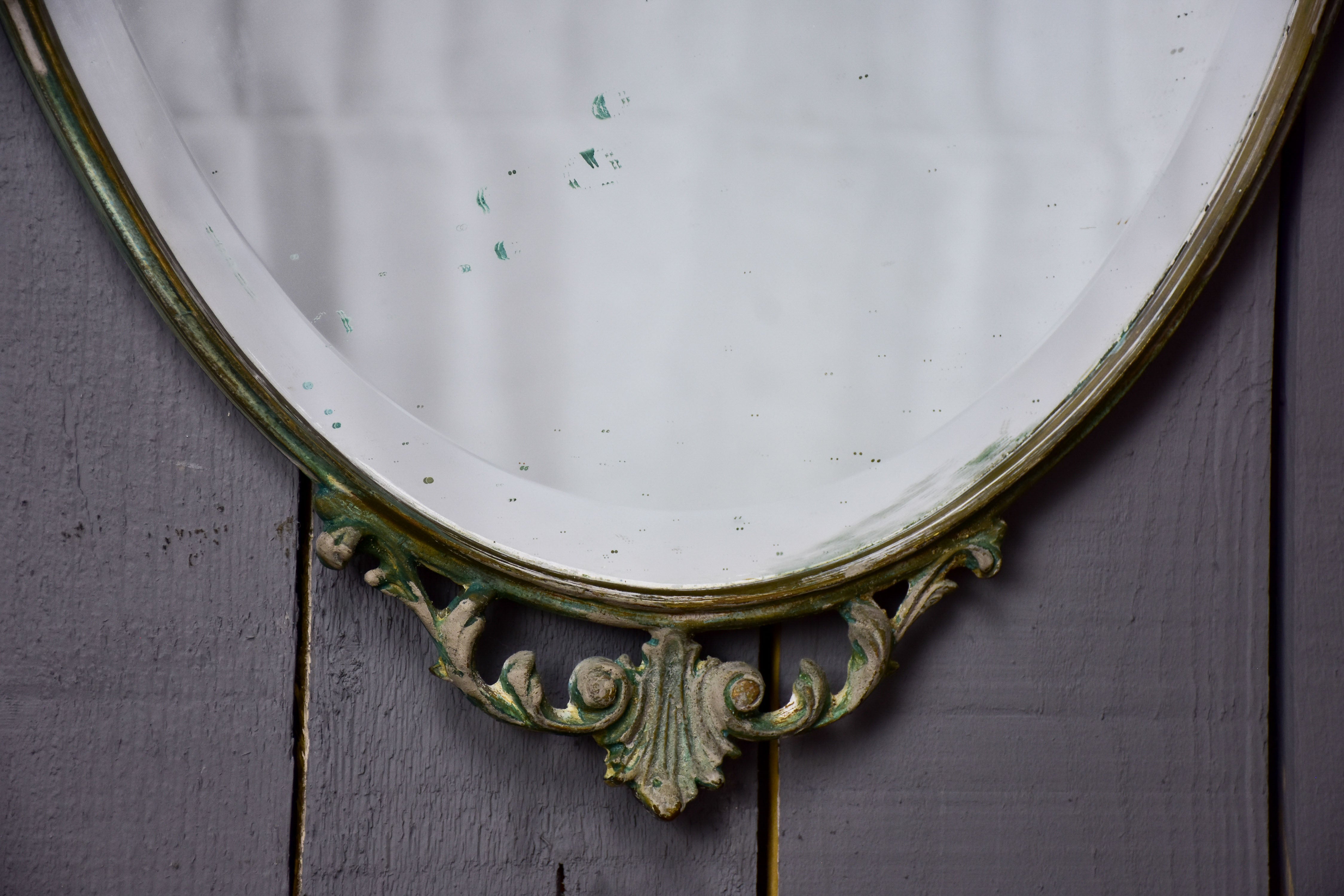 Vintage oval mirror with iron frame