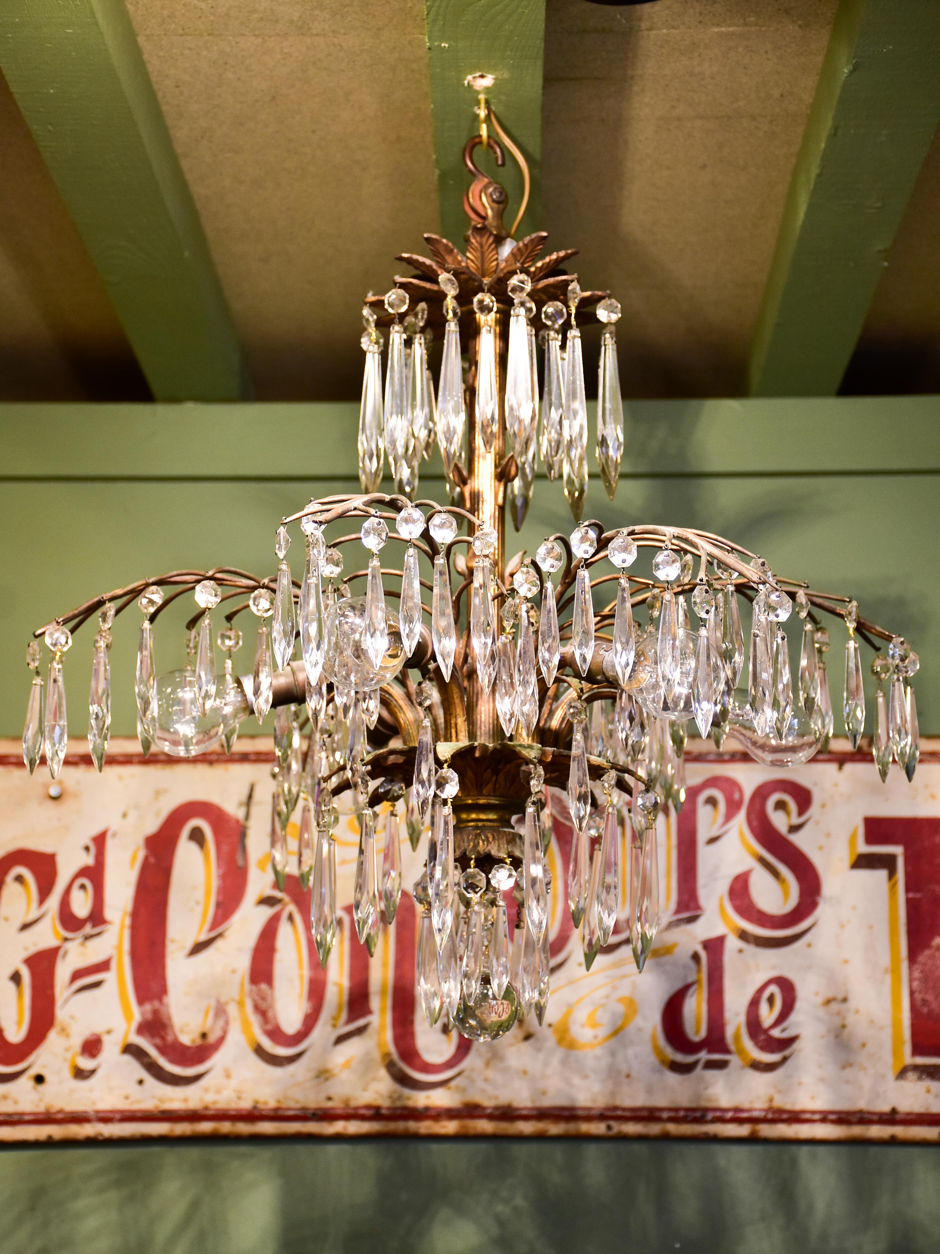 Gold palm frond chandelier with crystals