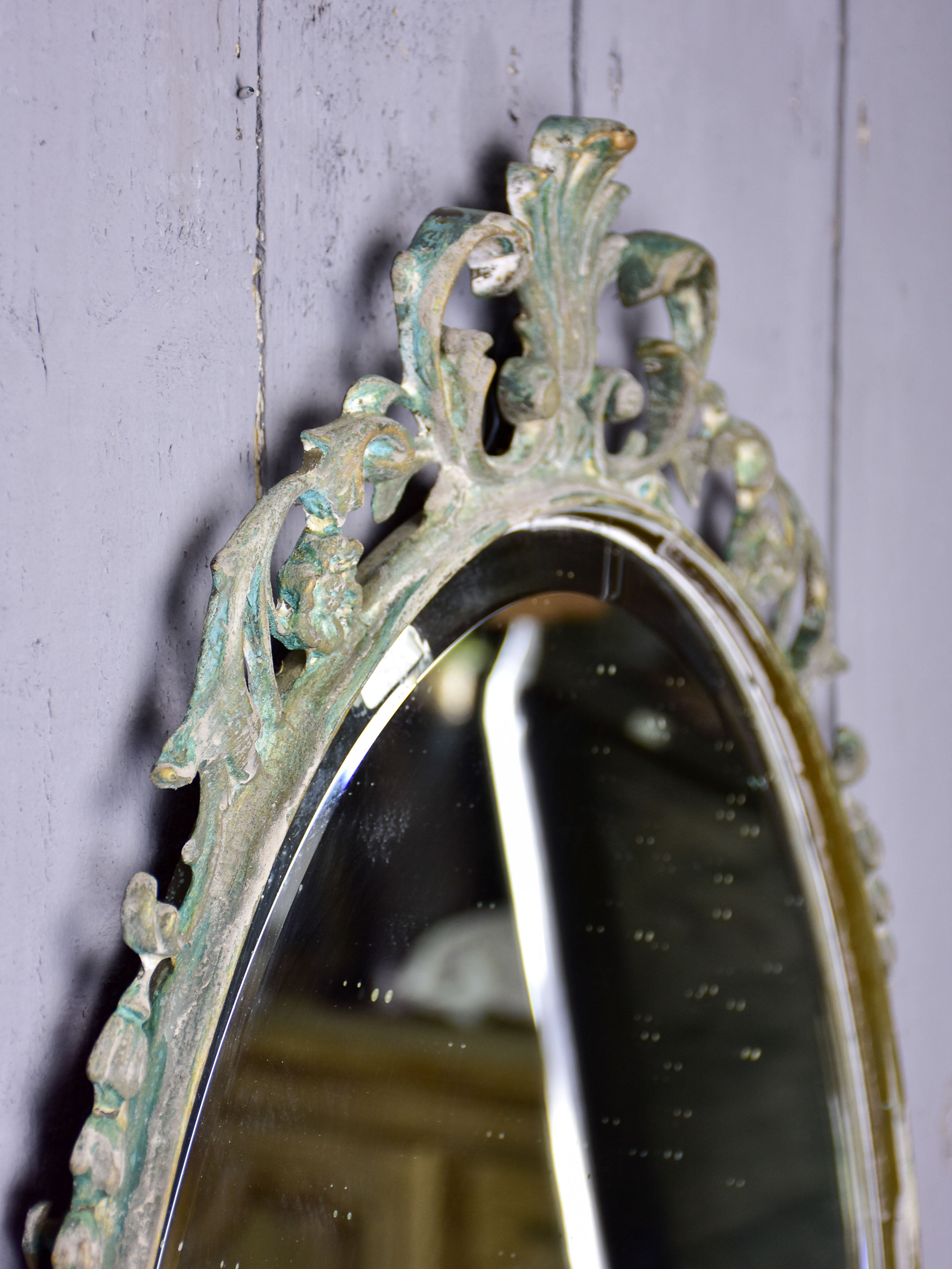 Vintage oval mirror with iron frame