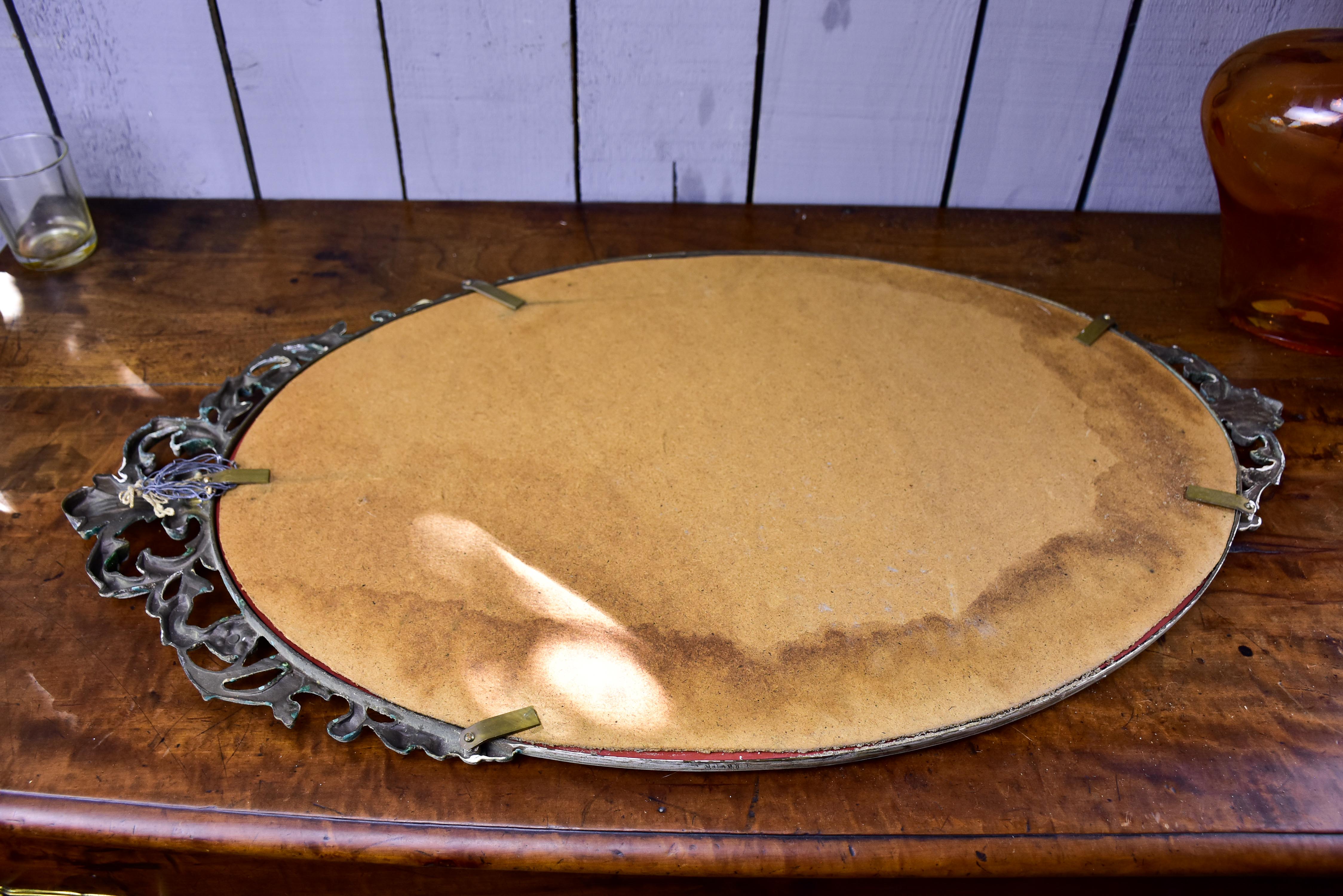 Vintage oval mirror with iron frame