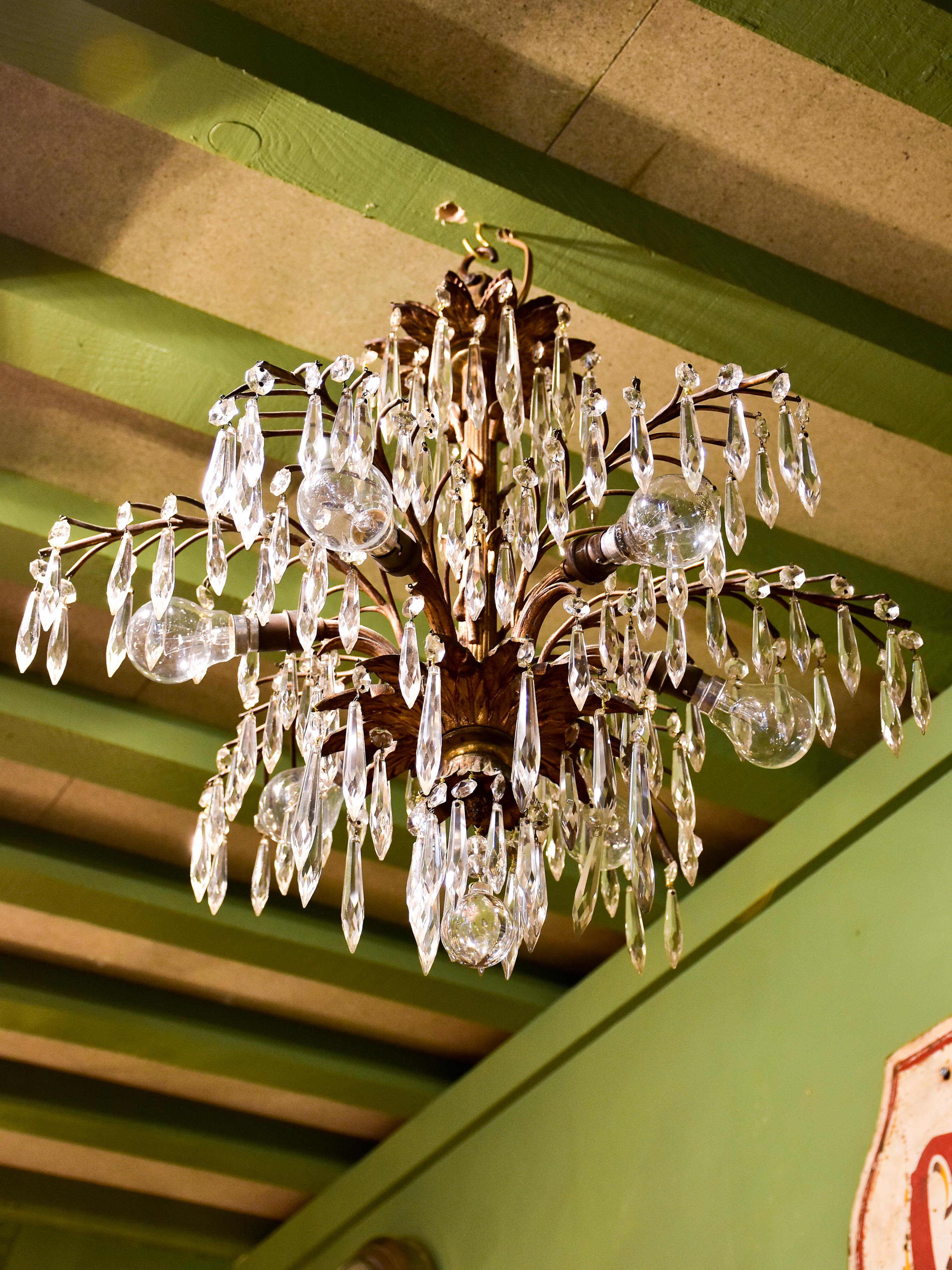 Gold palm frond chandelier with crystals