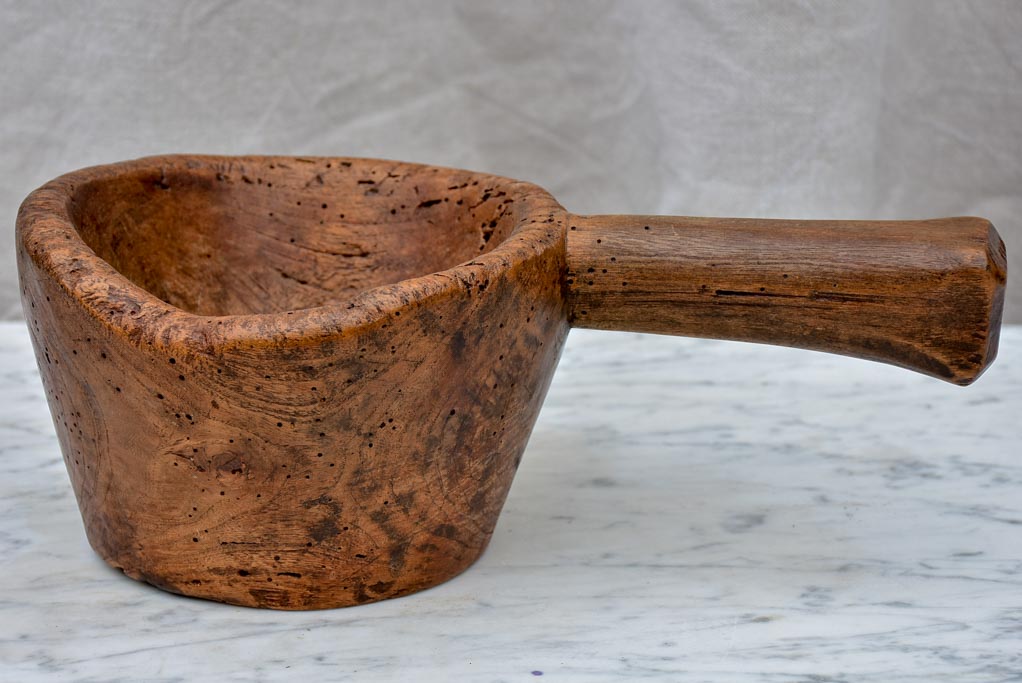 Primitive wooden bowl with handle