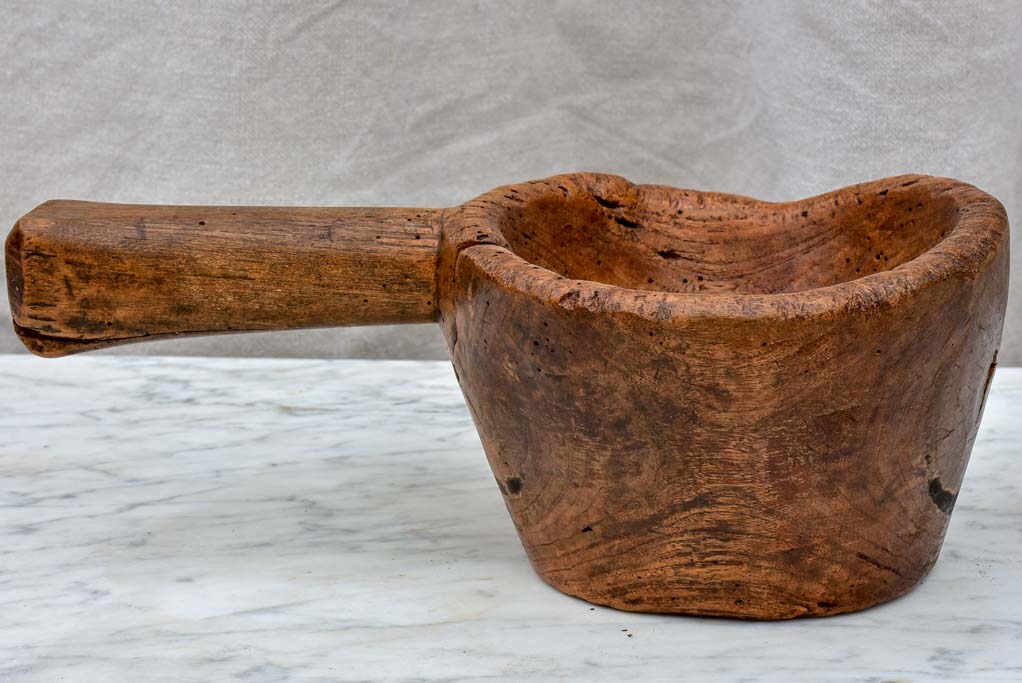 Primitive wooden bowl with handle