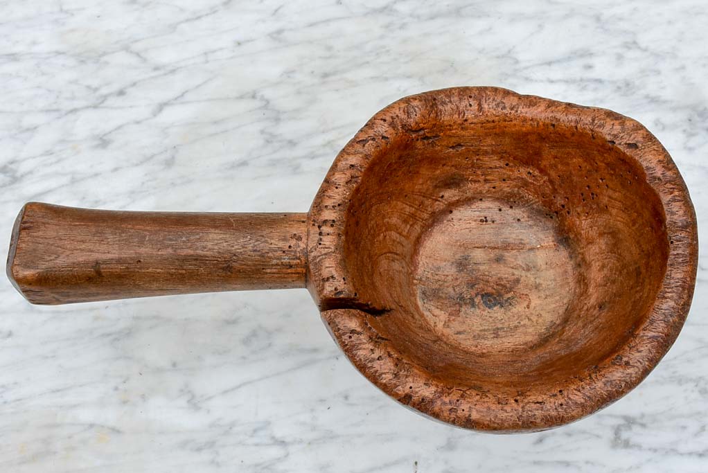 Primitive wooden bowl with handle