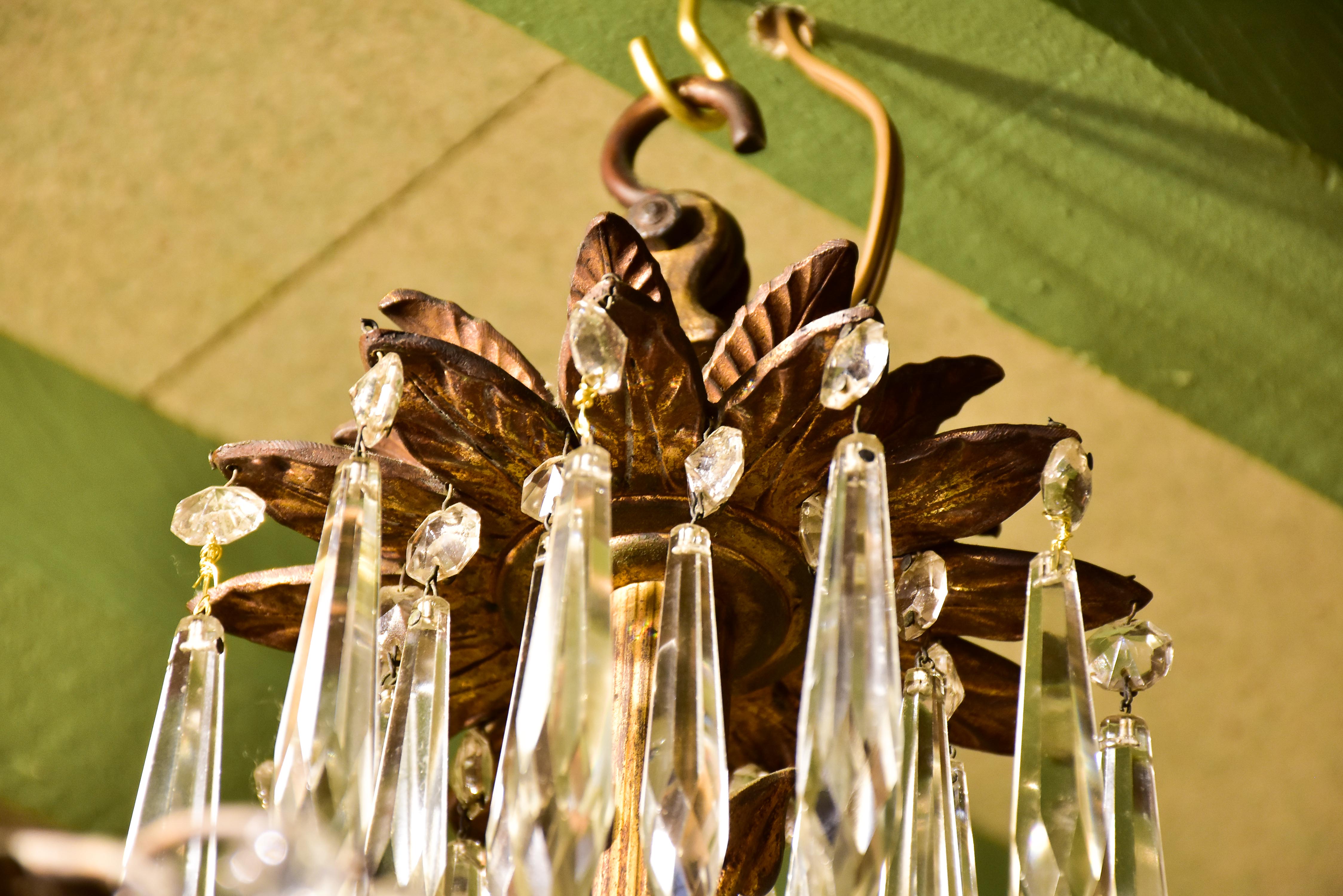 Gold palm frond chandelier with crystals