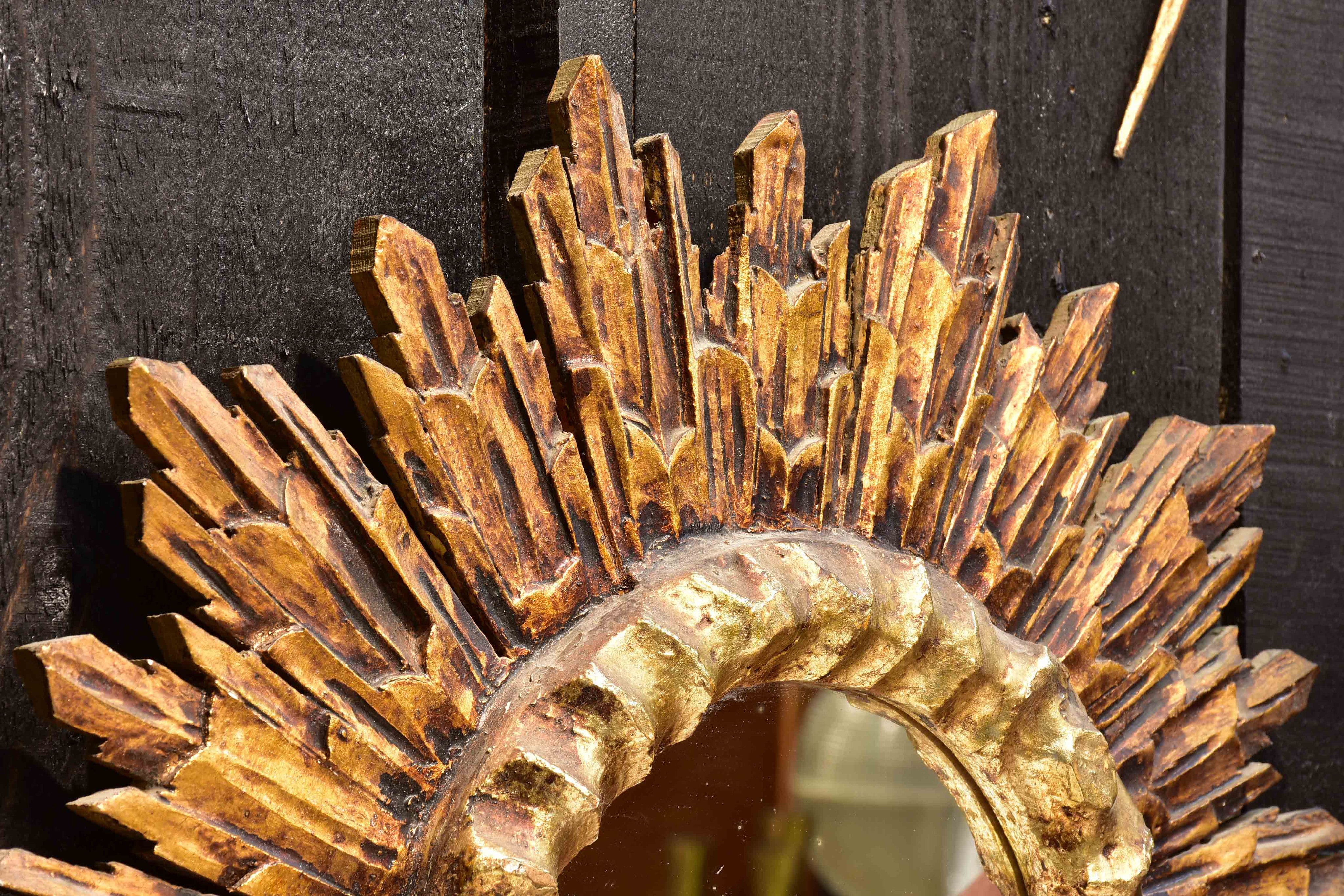 Vintage sunburst mirror with gilded carved frame