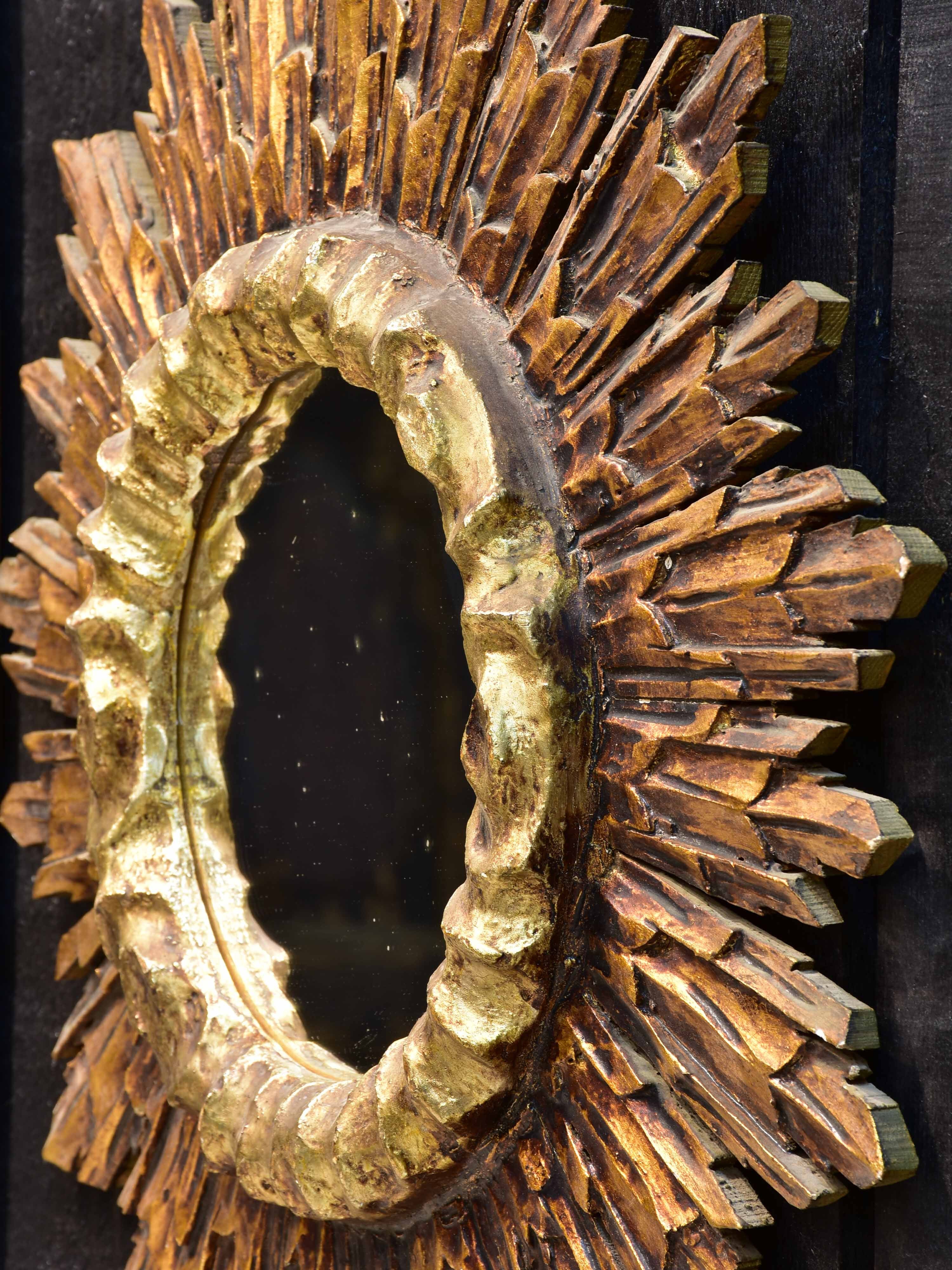 Vintage sunburst mirror with gilded carved frame