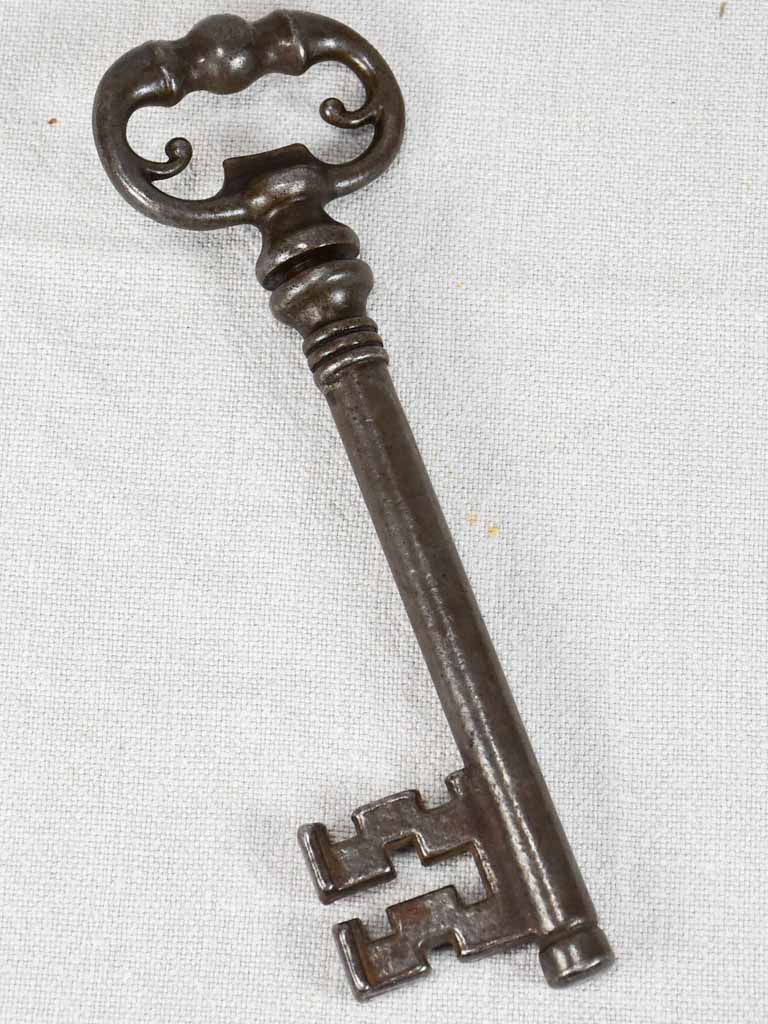 Antique French bottle opener hidden in a large key-shaped container 8¼"