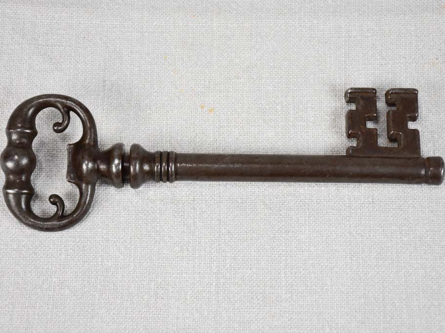 Antique French bottle opener hidden in a large key-shaped container 8¼"