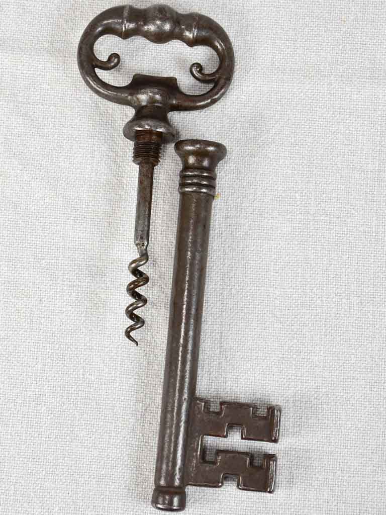 Antique French bottle opener hidden in a large key-shaped container 8¼"