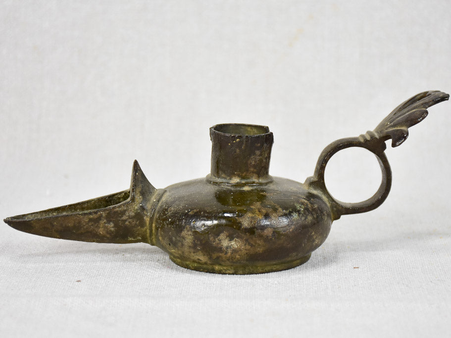 Evocative ancient bronze Aladdin lamp