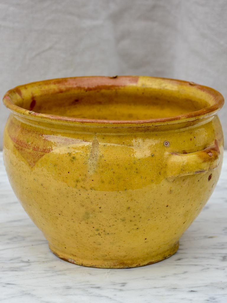 Antique French mixing bowl with yellow glaze