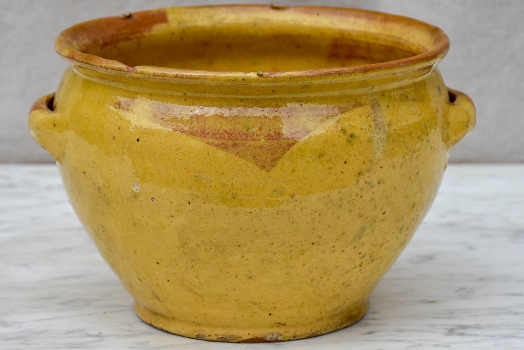 Antique French mixing bowl with yellow glaze