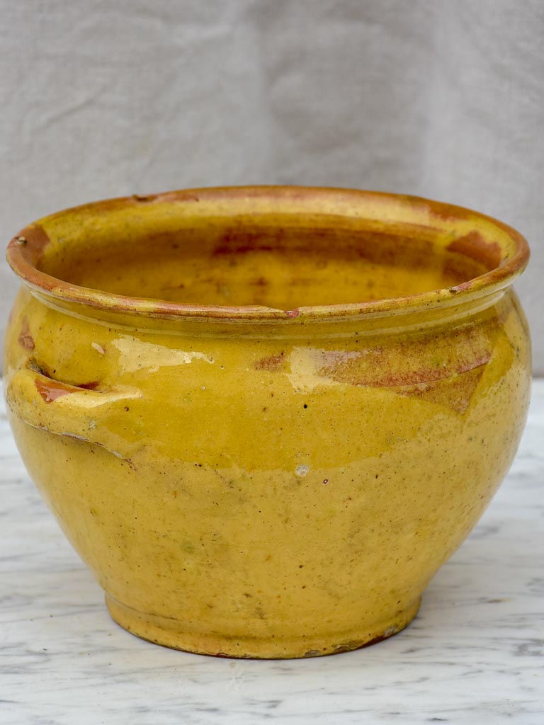 Antique French mixing bowl with yellow glaze