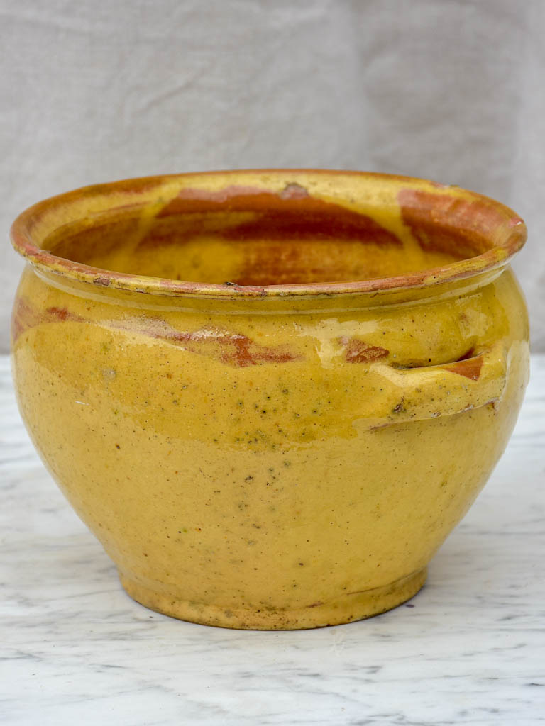 Antique French mixing bowl with yellow glaze