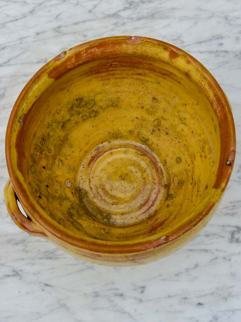 Antique French mixing bowl with yellow glaze