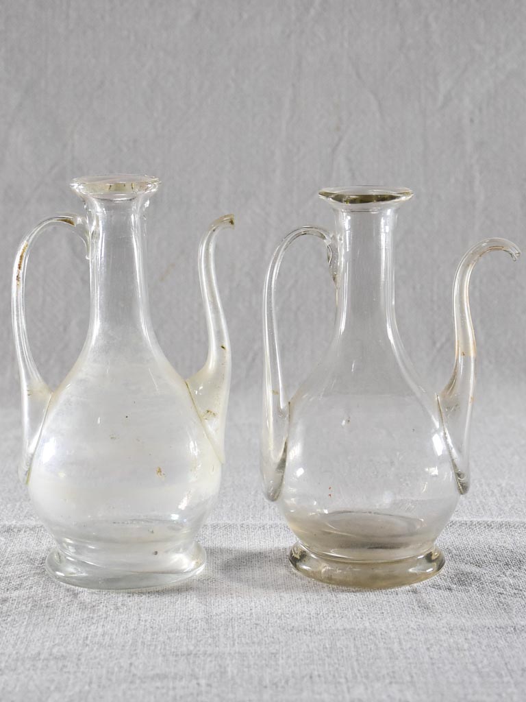 Two eighteenth-century blown glass oil pitchers