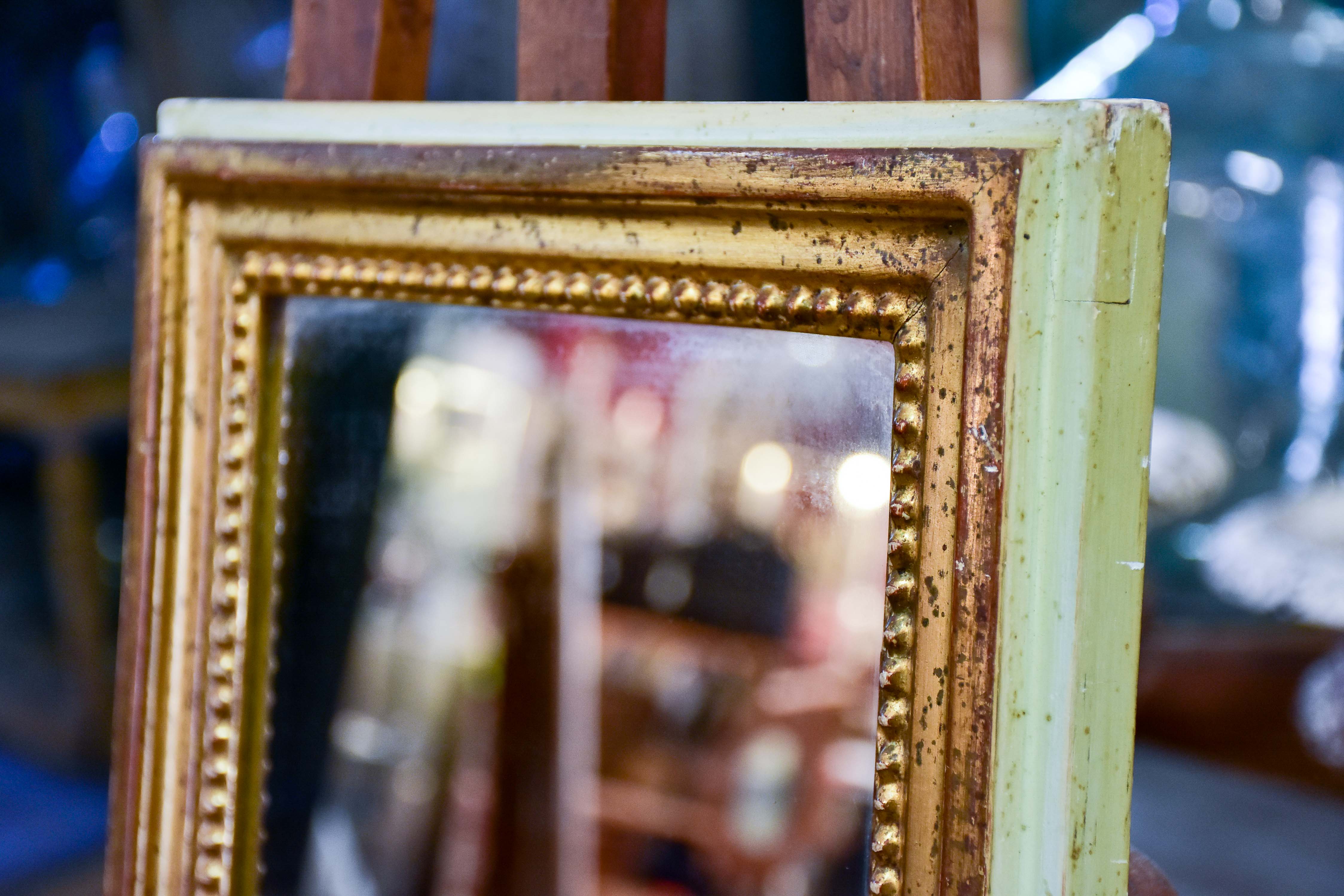 Narrow rectangular Louis Philippe mirror with gilded and sage green frame