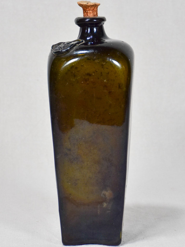 Dark green vintage rum bottle