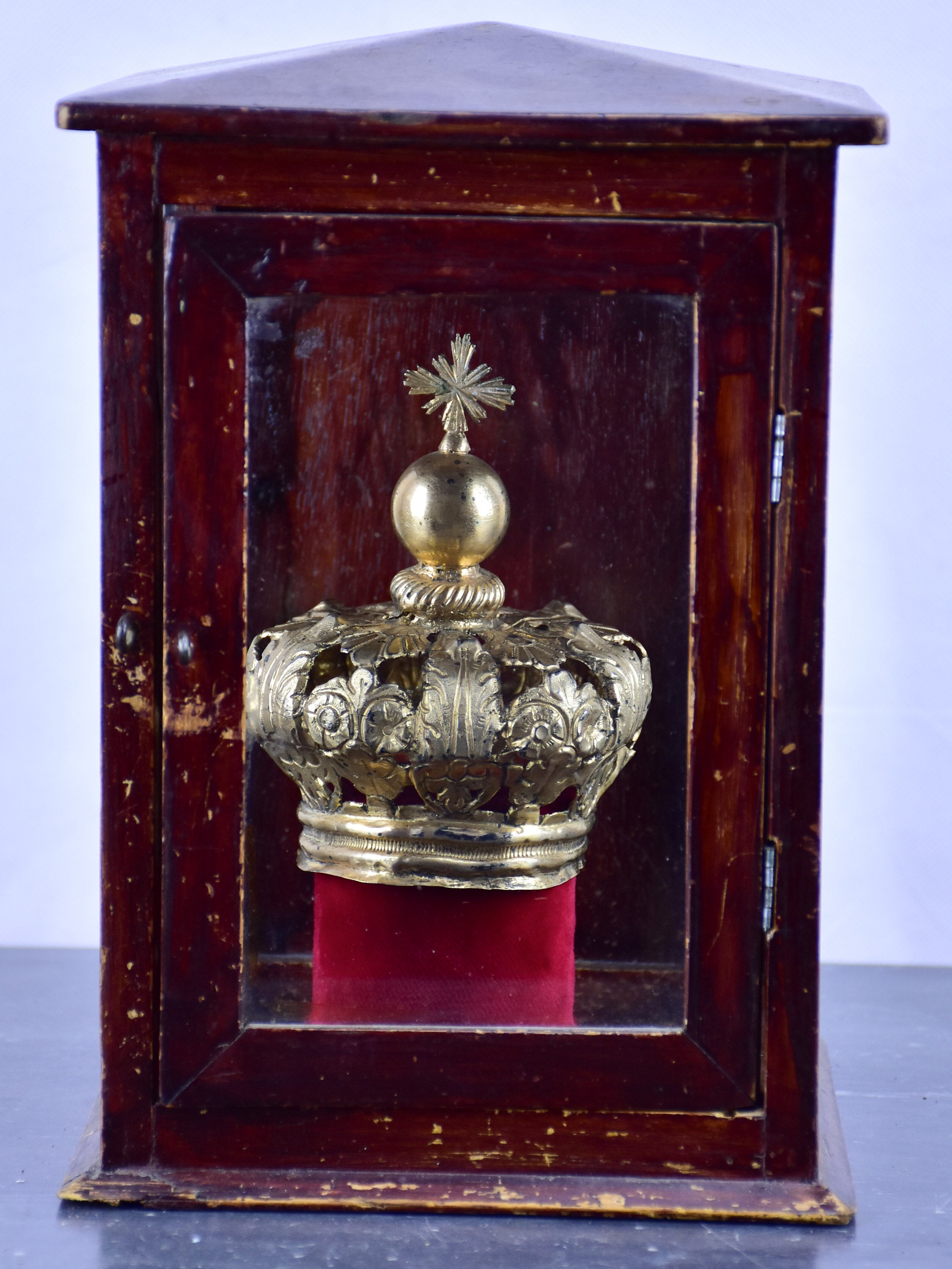 Vintage religious crown in a window box