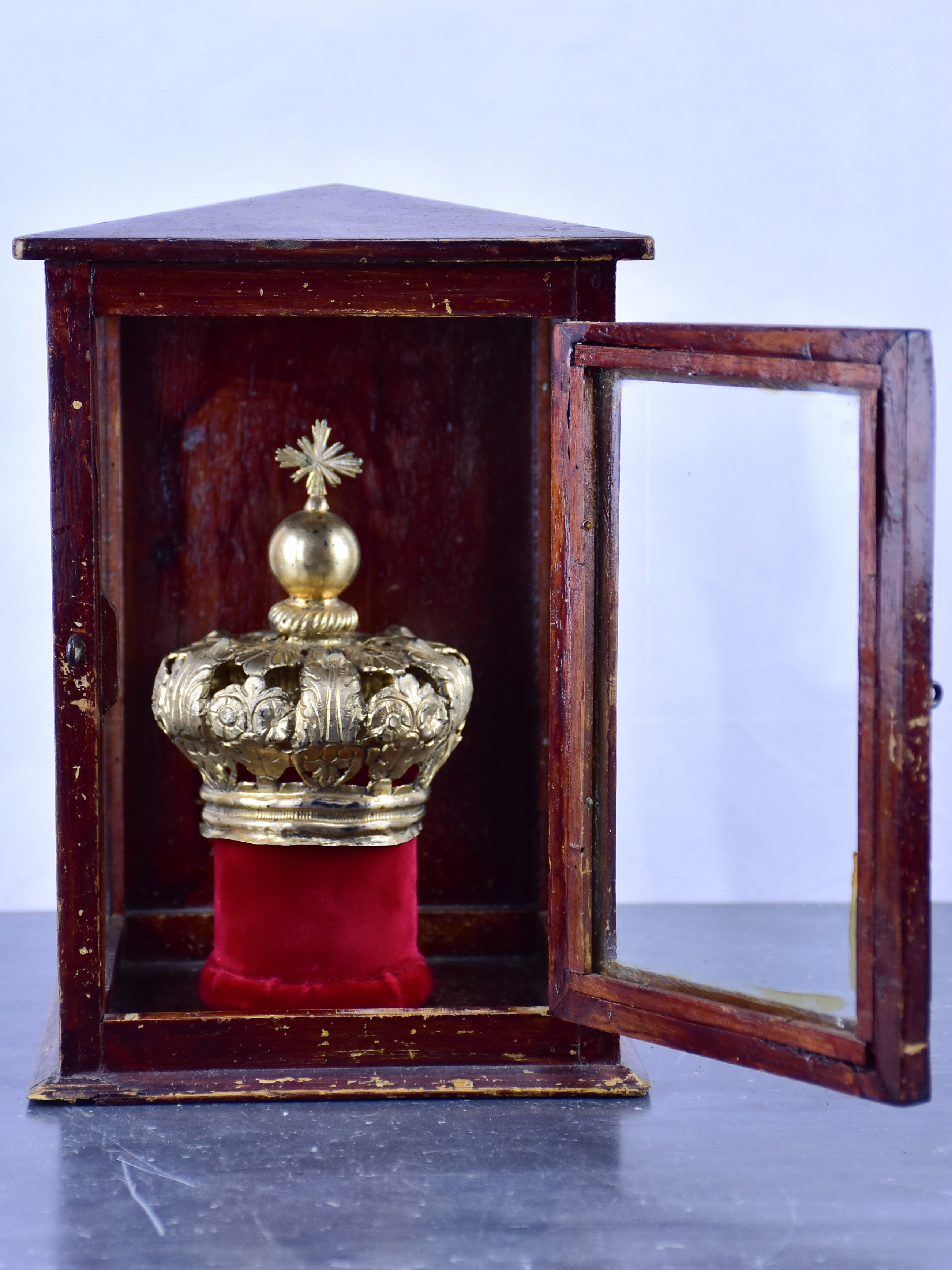 Vintage religious crown in a window box